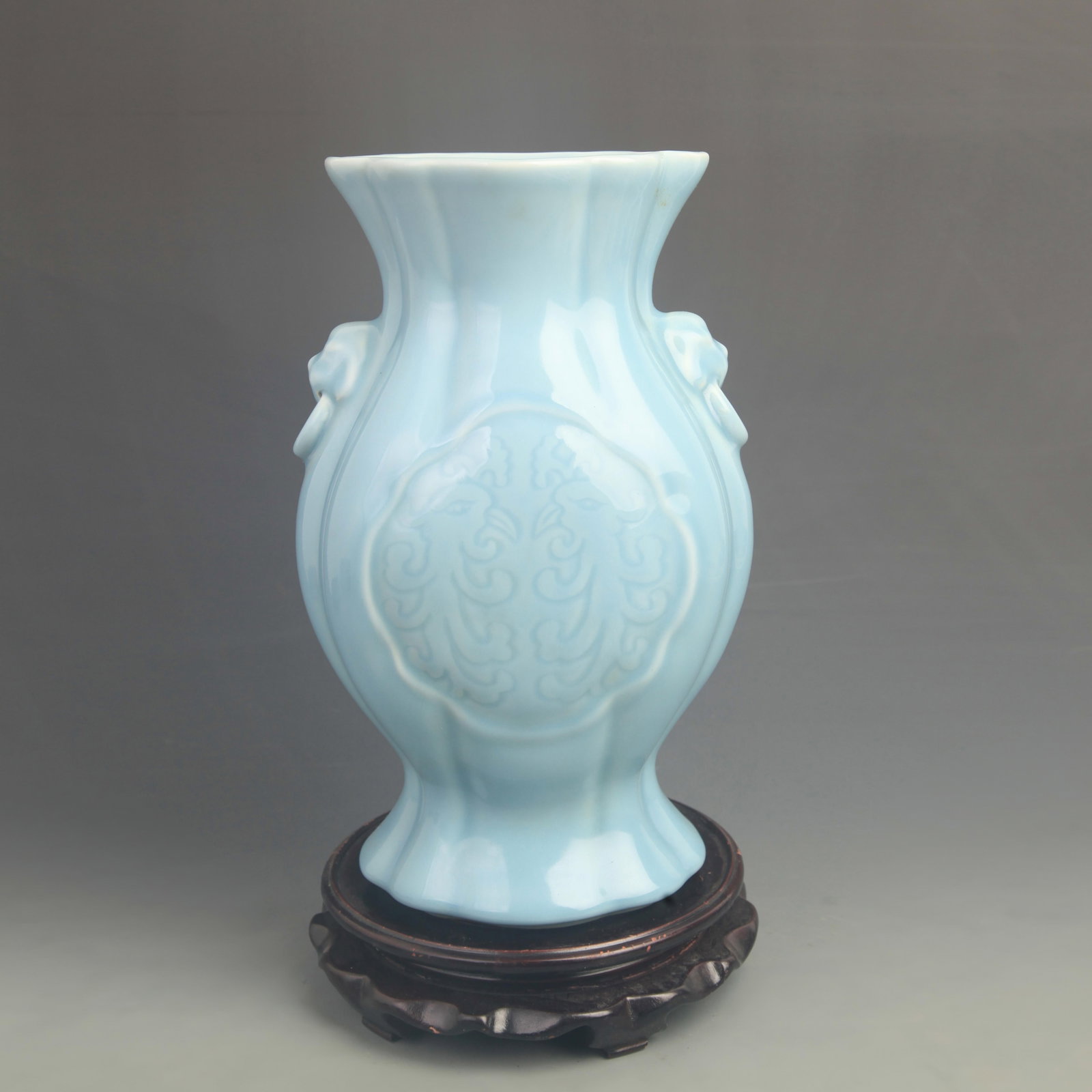SKY-BLUE-GLAZED BEAST-HANDLE BAOFU PATTERN PORCELAINVASE: Qing Dynasty Qian Long Period; High: 12.0 inch; Diameter: 7.80 inch. Wooden base for display only