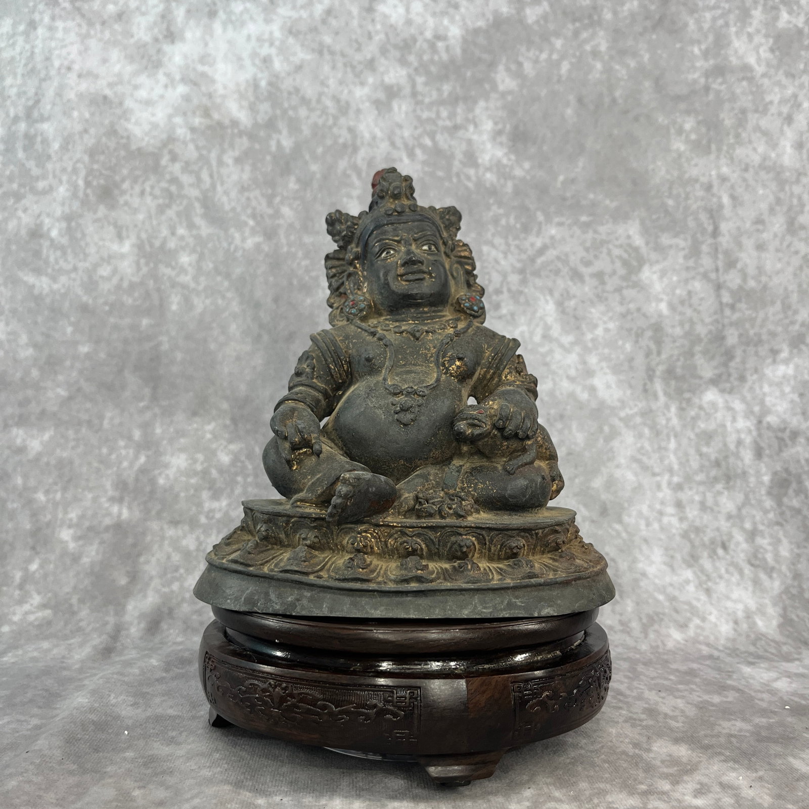 BRONZE STATUE OF JAMBHALA (THE BUDDHIST GOD OF WEALTH): Qing Dynasty; Long: 6.7 inch; Width: 5 inch; High: 7.6 inch; . Wooden base for display only
