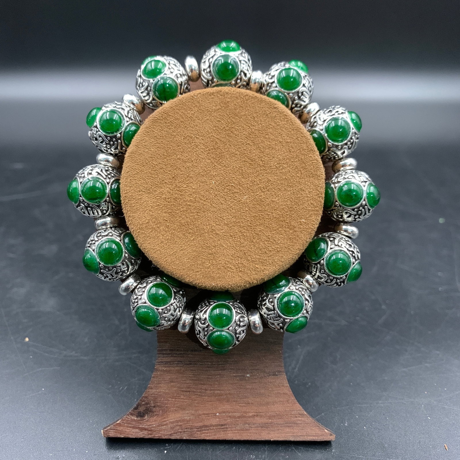 A FINE JADEITE BEAD BRACELET: Modern; Long: 4.2 inch; Diameter: 0.6 inch; . Wooden base for display only