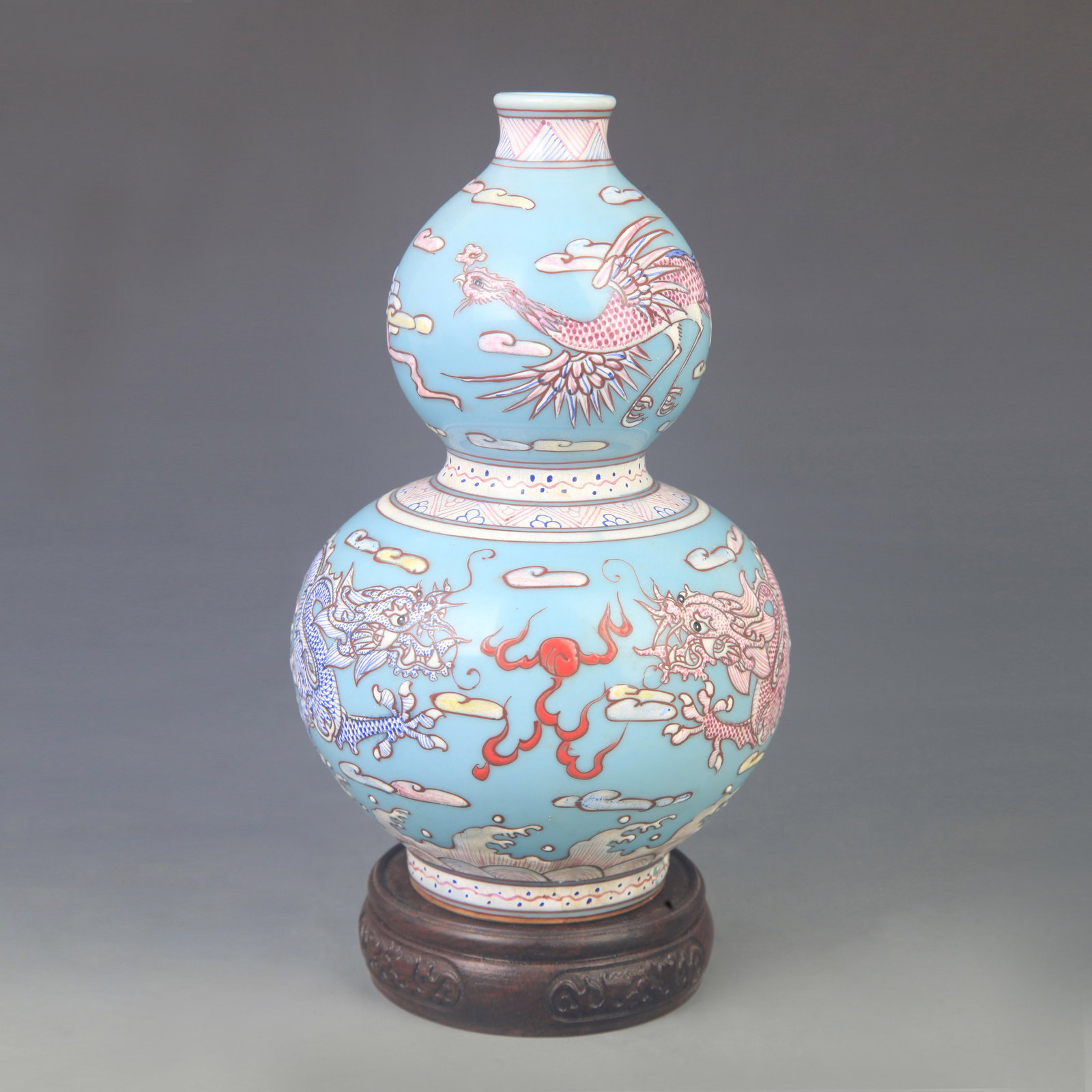 LIGHT GREEN DRAGON AND PHOENIX PATTERN GOURD PORCELAIN VASE: Qing Dynasty Qian Long Period; High: 9.00 inch; Diameter: 5.50 inch; . Wooden base for display only