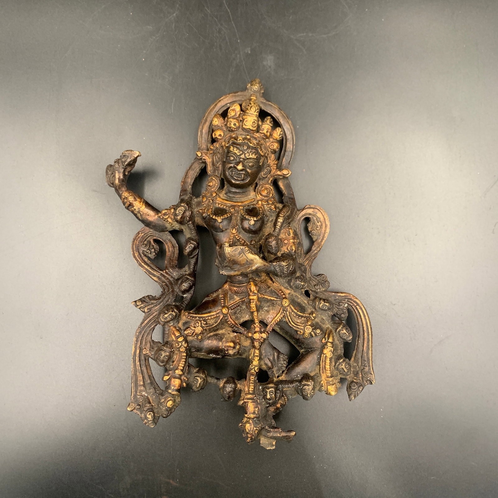 A FINE GILT-BRONZE TIBETAN DEITY: Qing Dynasty; Long: 8.4 inch; Width: 3.4 inch; High: 11.8 inch; . Wooden base for display only