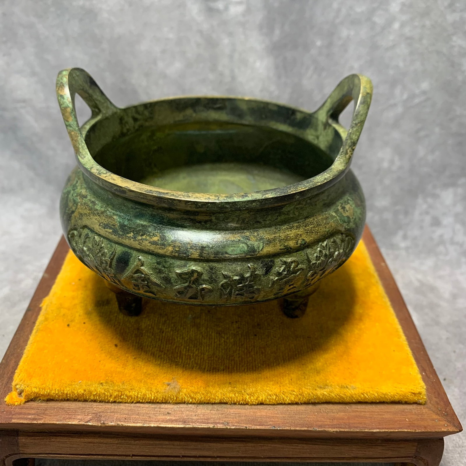 XUAN DE MARKED BRONZE INCENSE BURNER WITH WEALTH AND TREASURE DESIGN: Ming Dynasty Style; High: 3.7 inch Diameter: 4.6 inch. Wooden base for display only