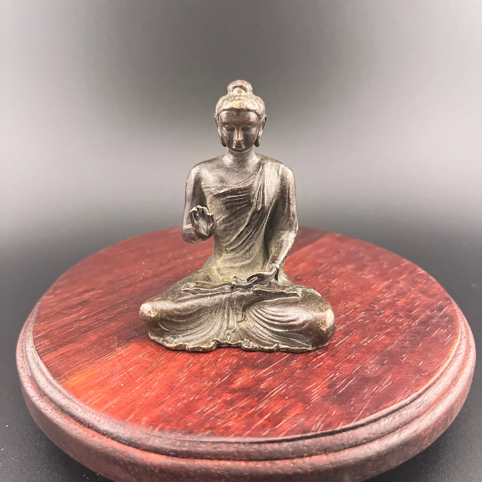 MINIATURE BRONZE SEATED BUDDHA: Qing Dynasty; Long: 2 inch; Width: 1.6 inch; High: 2.48 inch; . Wooden base for display only