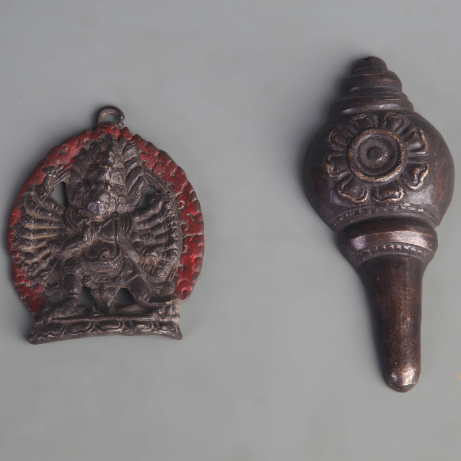 A GROUP OF TIBETAN BUDDHIST OBJECTS, INCLUDING A RITUAL CONCH AND A BUDDHA FIGURE: Qing Dynasty; Long: 3.4 inch to 4.7 inch; Width: 2.1 inch to 2.6 inch. Wooden base for display only