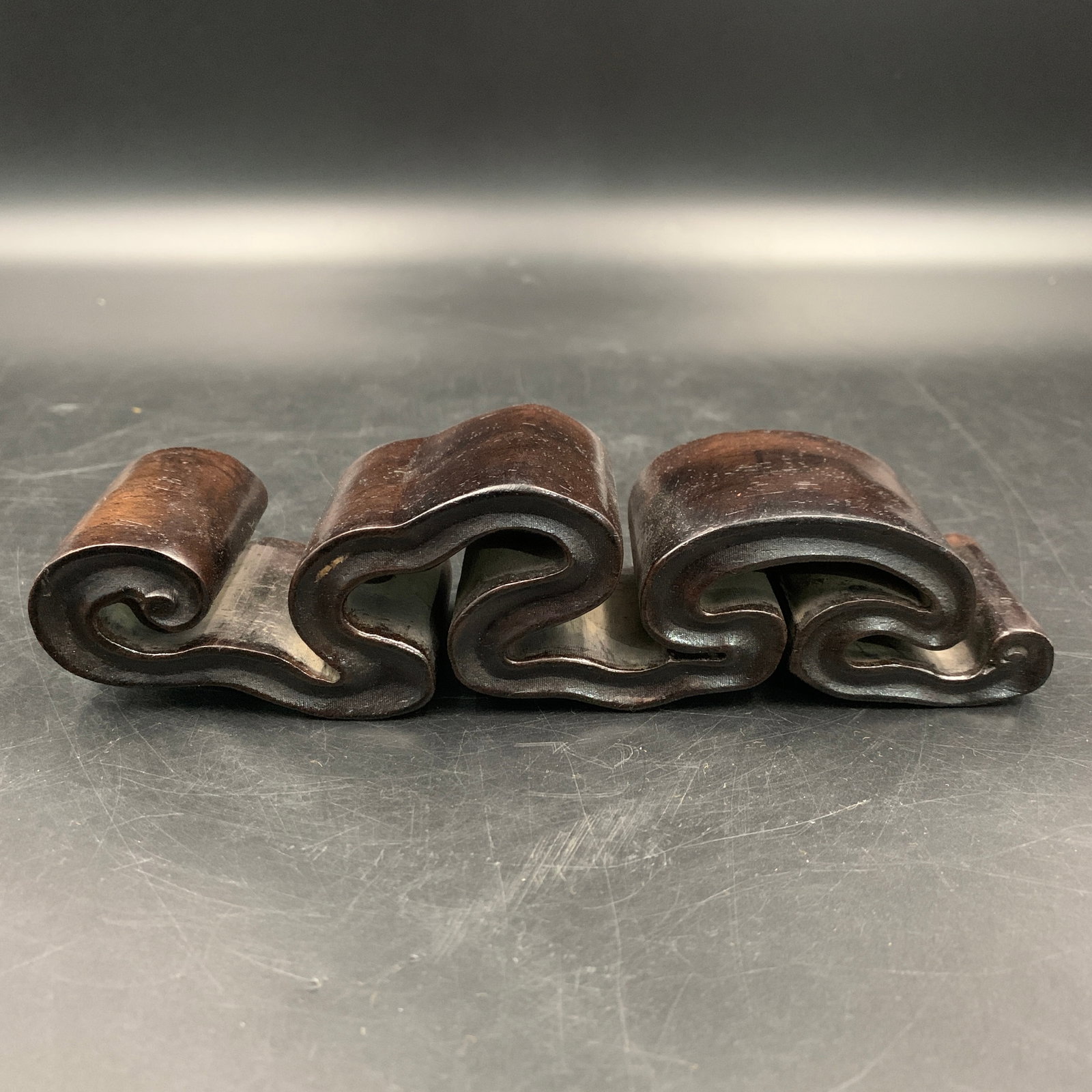 CARVED ZITAN WOOD RUYI-CLOUD SCROLL PEN STAND: Modern; Long: 7.1 inch; Width: 1.8 inch; High: 1.6 inch; . Wooden base for display only