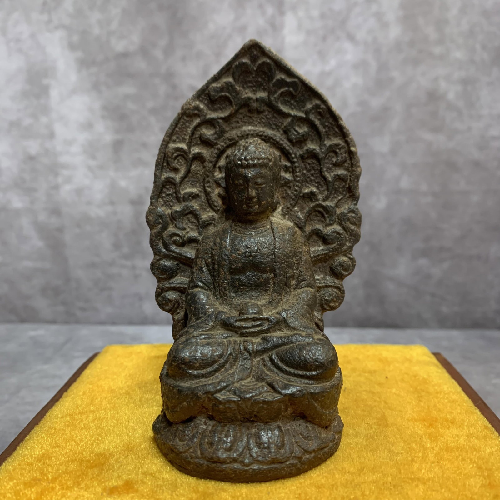 A SMALL CAST IRON AMITABHA BUDDHA STATUE: 20th Century; High: 4.7 inch; Width: 2.6 inch; Long: 2.2 inch . Wooden base for display only