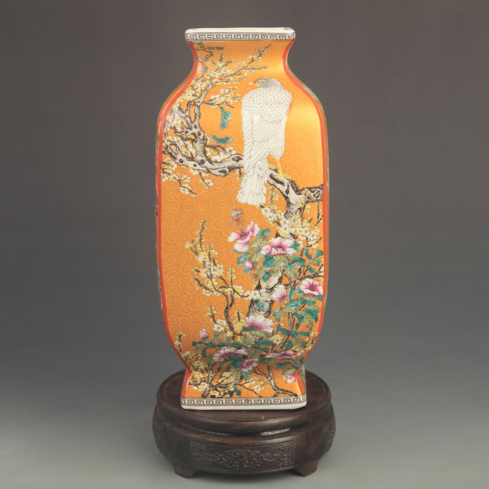 FAMILLE ROSE YELLOW-GROUND FLORAL SQUARE PATTERN VASE: Qing Dynasty Qian Long Period; High: 11.0 inch; Diameter: 4.80 inch; . Wooden base for display only