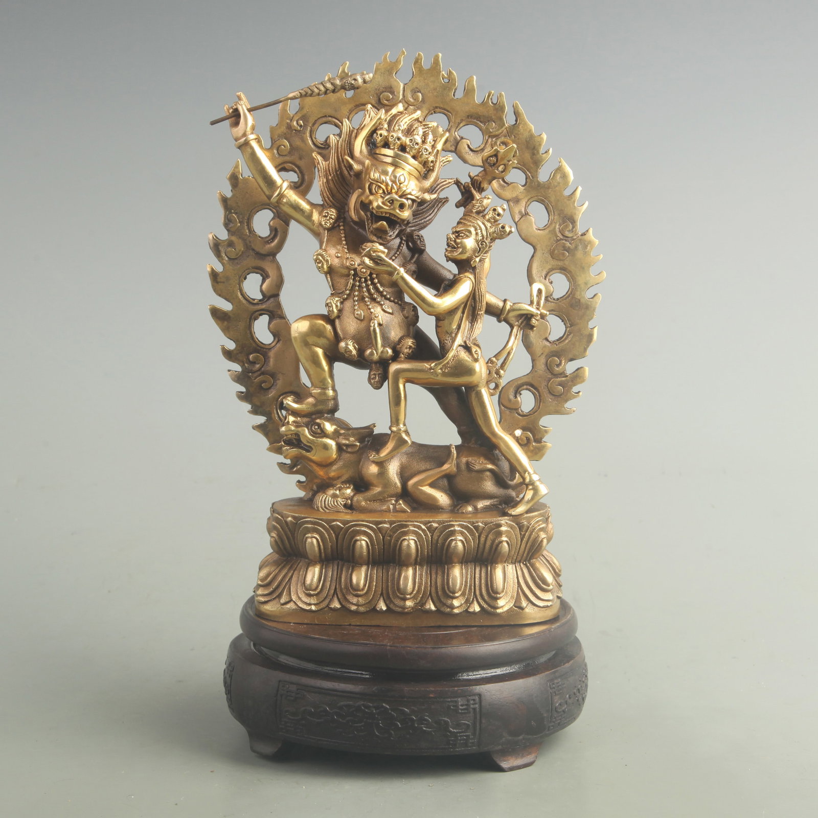 TIBETAN-STYLE GILT BRONZE STATUE OF YAMA DHARMARAJA: 20th Century; High: 8.50 inch; W: 6.00 inch. Wooden base for display only