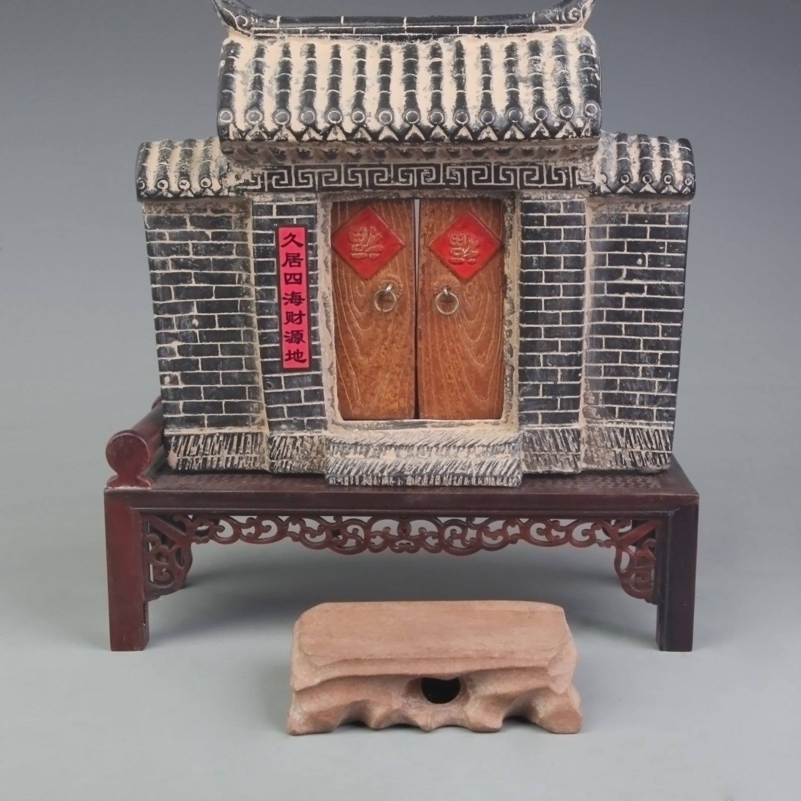 A FINE STONE MADE CHINESE DOOR FIGURE WITH STAND: Modern; Long: 9.0 inch; Width: 4.0 inch; High: 9.7 inch. Wooden base for display only