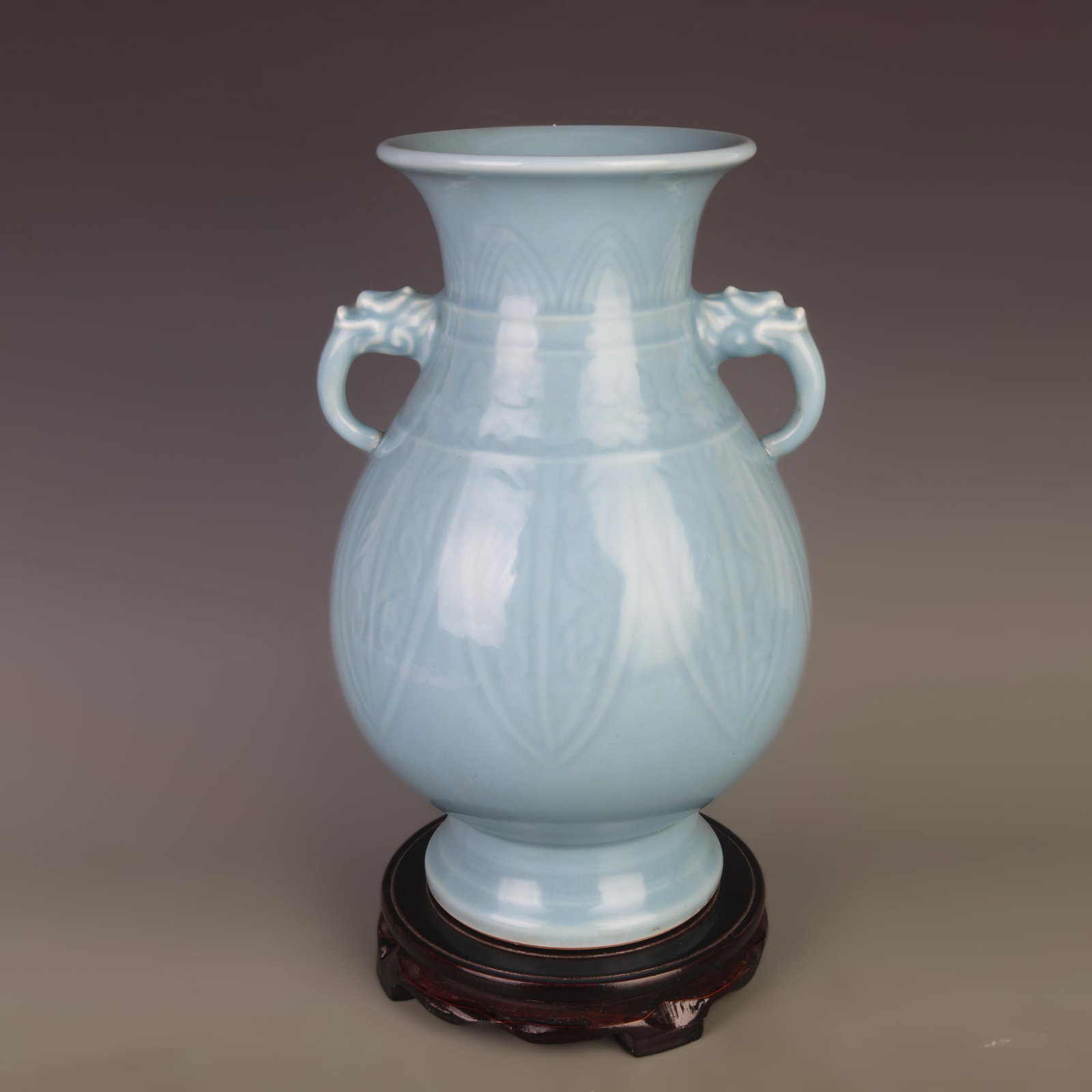 CELADON MONOCHROME GLAZE DOUBLE-HANDLED PORCELAIN VASE: Qing Dynasty Qian Long Period; Diameter: 8.2 inch; High: 12.6 inch ;Wooden base for picture and display only.