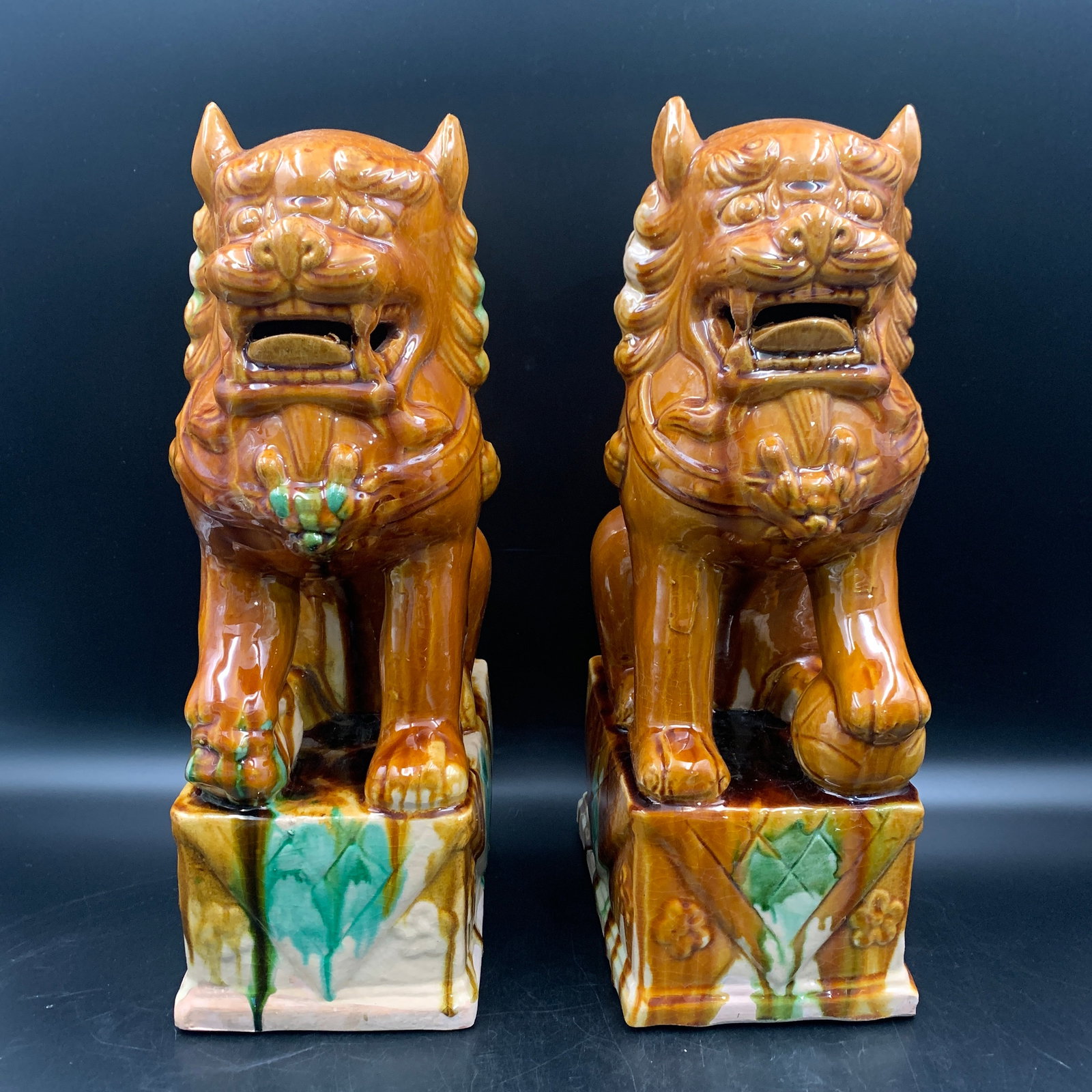 PAIR OF SANCAI-GLAZED FOO DOGS (GUARDIAN LIONS): Ming Dynasty Style; Long: 7.6 inch; Width: 5 inch; High: 14.5 inch; ;Wooden base for picture and display only.
