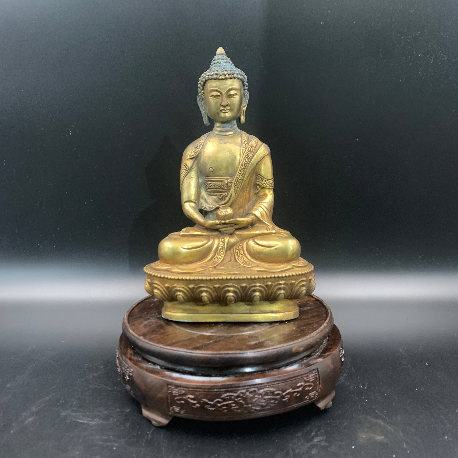 GILT-BRONZE MEDICINE BUDDHA (BHAISAJYAGURU) STATUE: Qing Dynasty; Long: 4.9 inch; Width: 3.3 inch; High: 7.9 inch; ;Wooden base for picture and display only.
