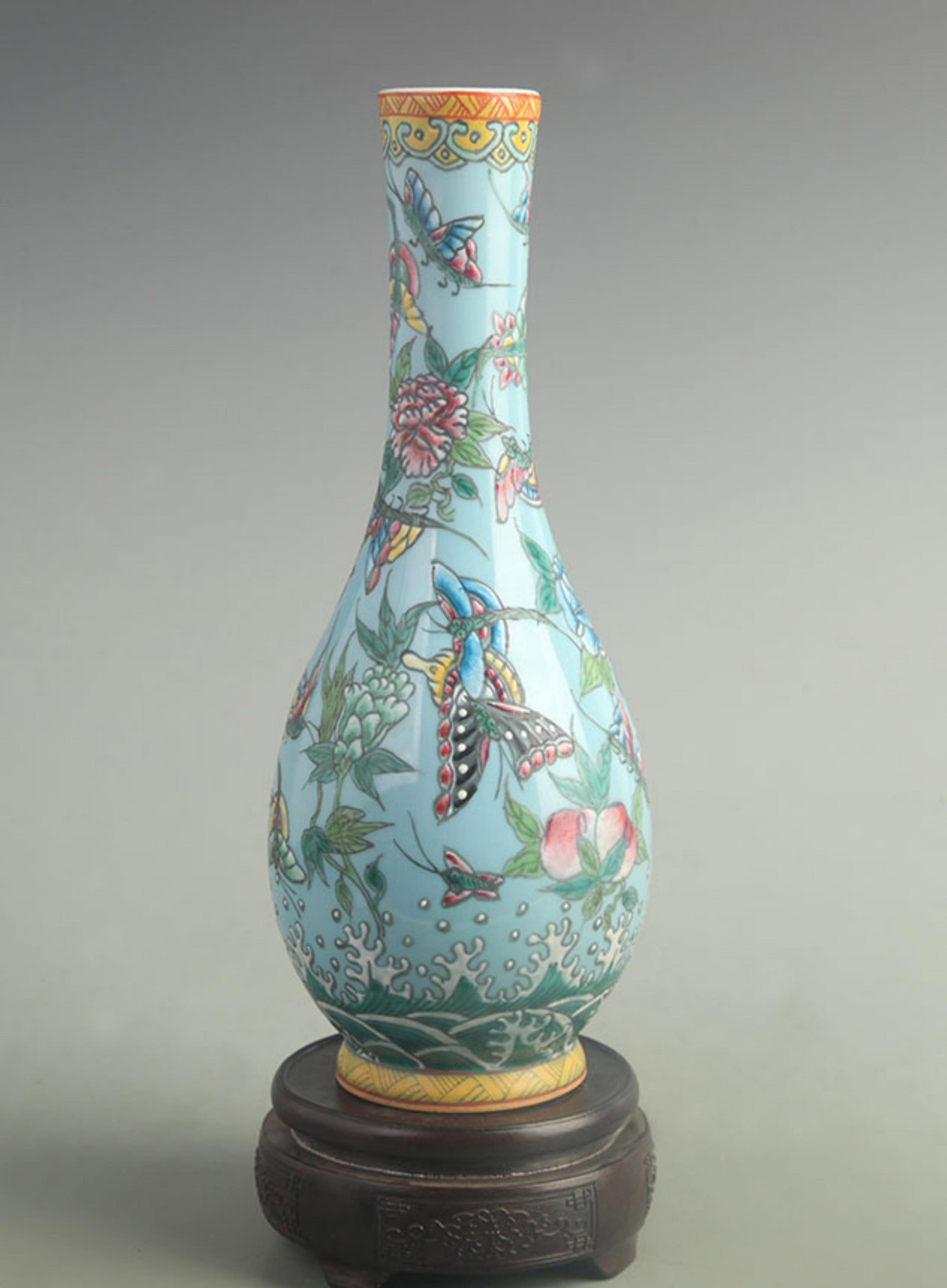 FAMILLE ROSE BLUE GROUND FLORAL LONG NECK VASE: Qing Dynasty Qian Long Period; High: 11.5 inch; Width: 4.20 inch; ;Wooden base for picture and display only.