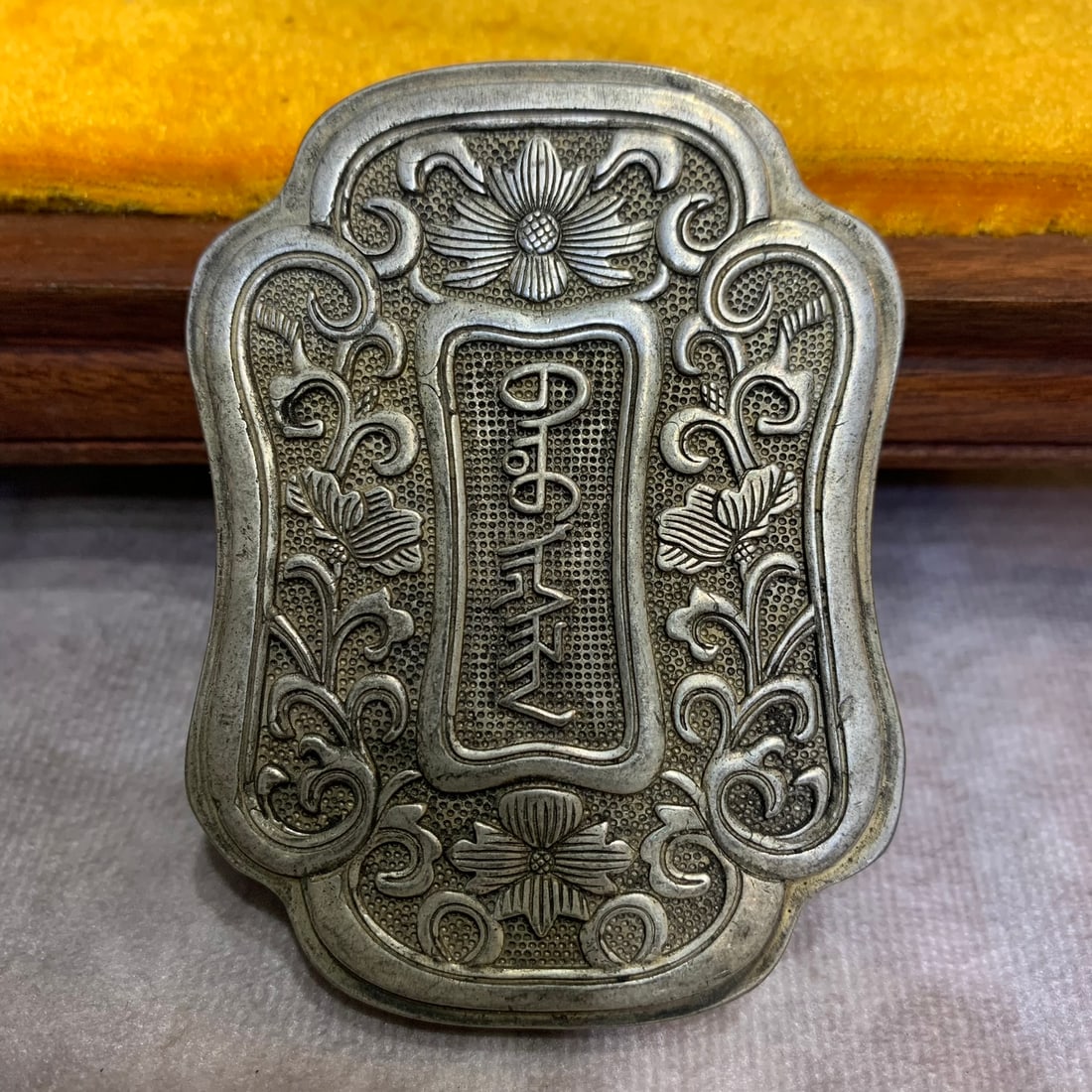 A FINE MADE WHITE BRONZE JIE PAI PENDANT: Modern; High: 2.9 inch; Width: 2.1 inch ;Wooden base for picture and display only.