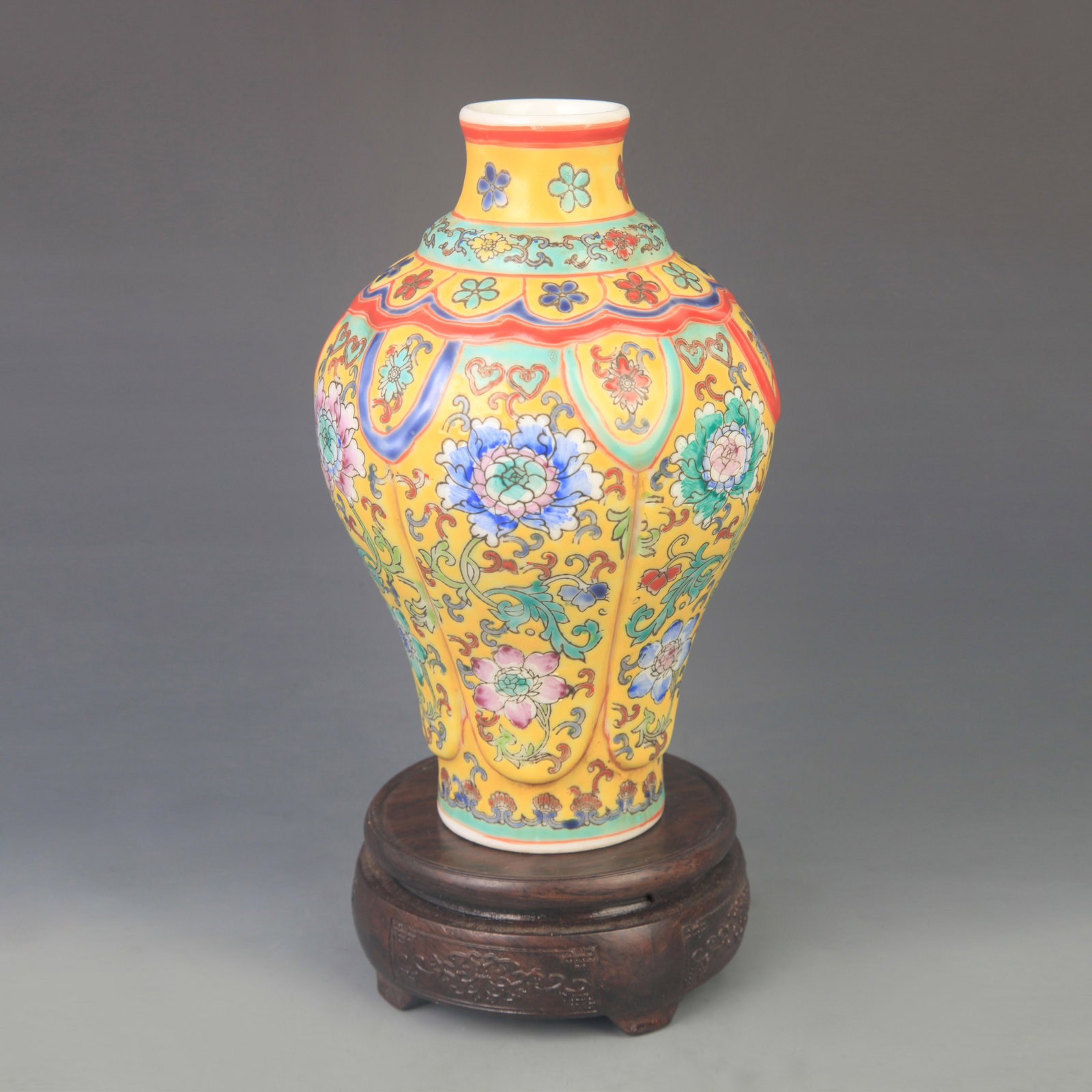YELLOW GROUND FAMILLE ROSE FLORAL DECORATIVE PORCELAIN VASE: Qing Dynasty Qian Long Period; High: 8.50 inch; Diameter: 5.00 inch; ;Wooden base for picture and display only.
