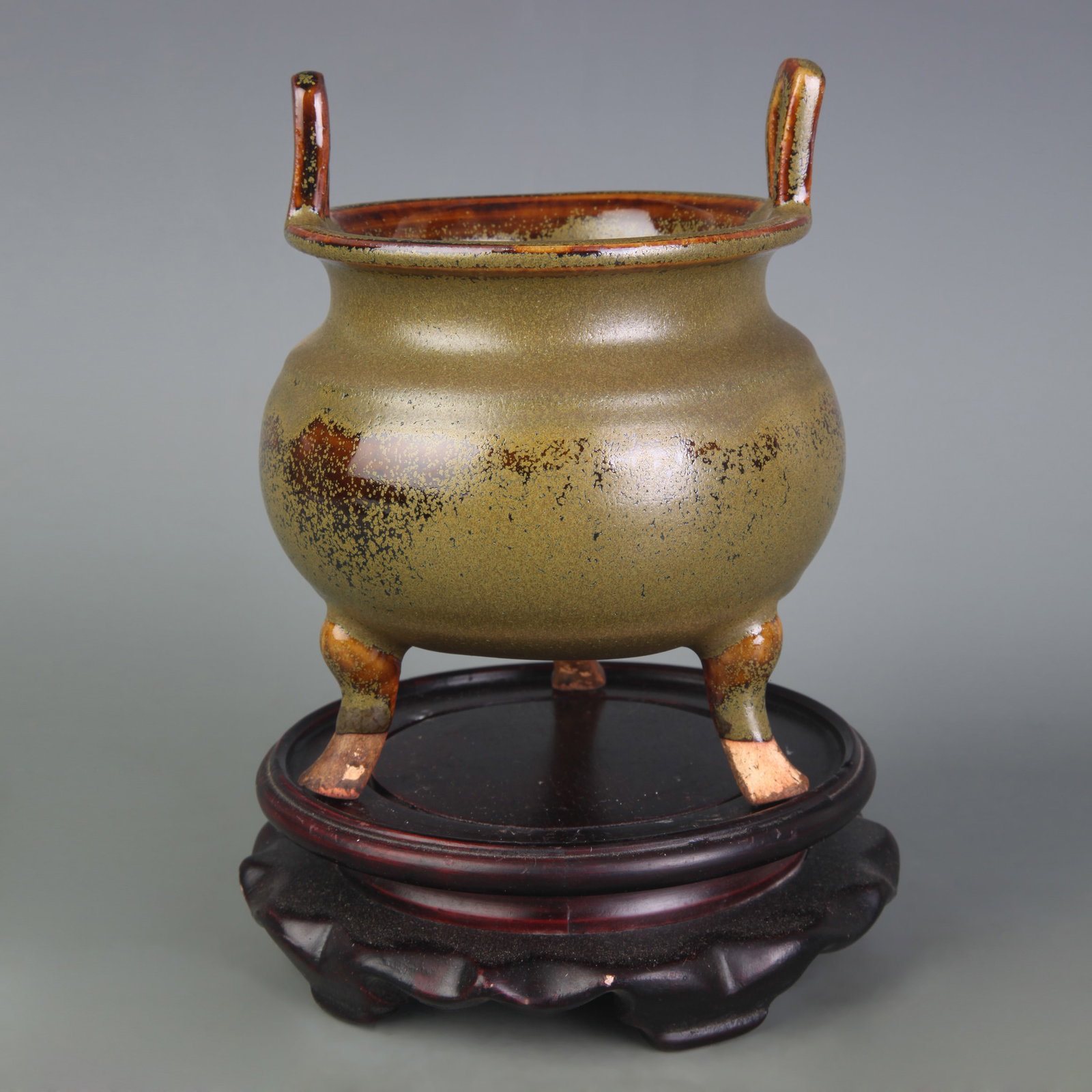 EEL-YELLOW-GLAZED TRIPOD INCENSE BURNER WITH UPRIGHT HANDLES: Qing Dynasty; Width: 4.2 in ; High: 5.5 in ;Wooden base for picture and display only.