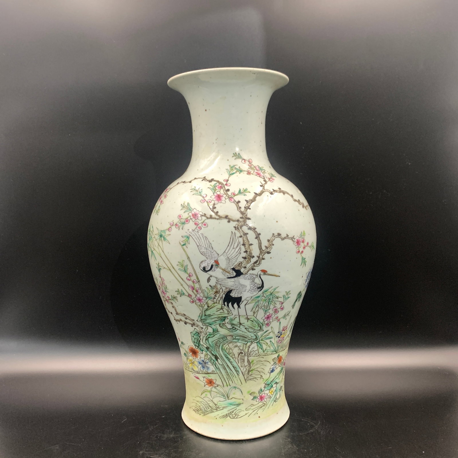 FAMILLE ROSE "CRANES AND PINES" BALUSTER VASE: Qing Dynasty; High: 16.2 inch; Diameter: 8.1 inch; ;Wooden base for picture and display only.