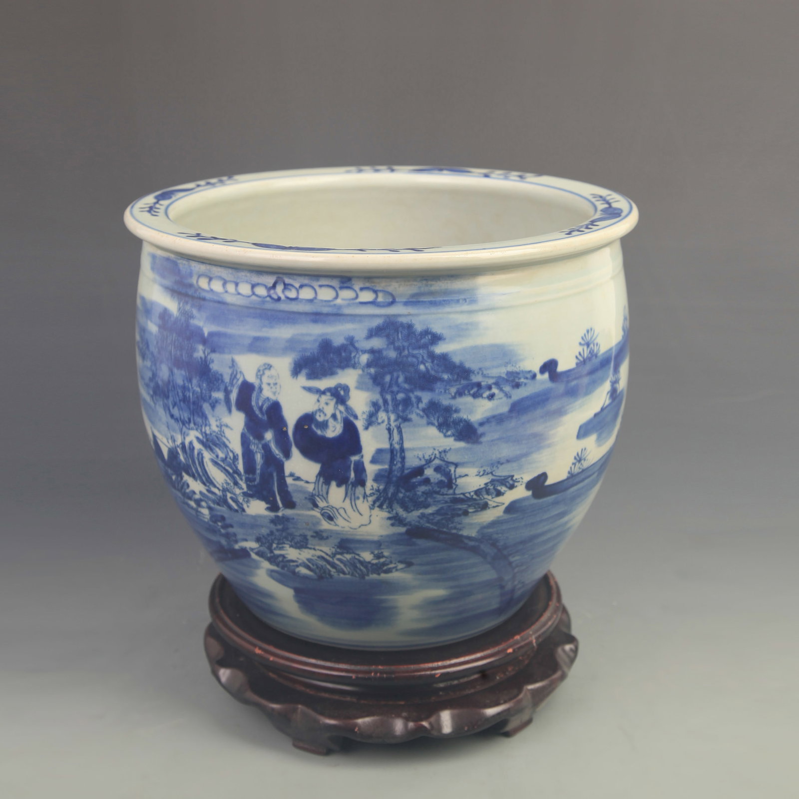 BLUE AND WHITE LANDSCAPE AND FIGURE PORCELAIN SCROLL BARREL: Qing Dynasty Kangxi Period; High: 8.60 inch; Diameter: 9.80 inch; ;Wooden base for picture and display only.