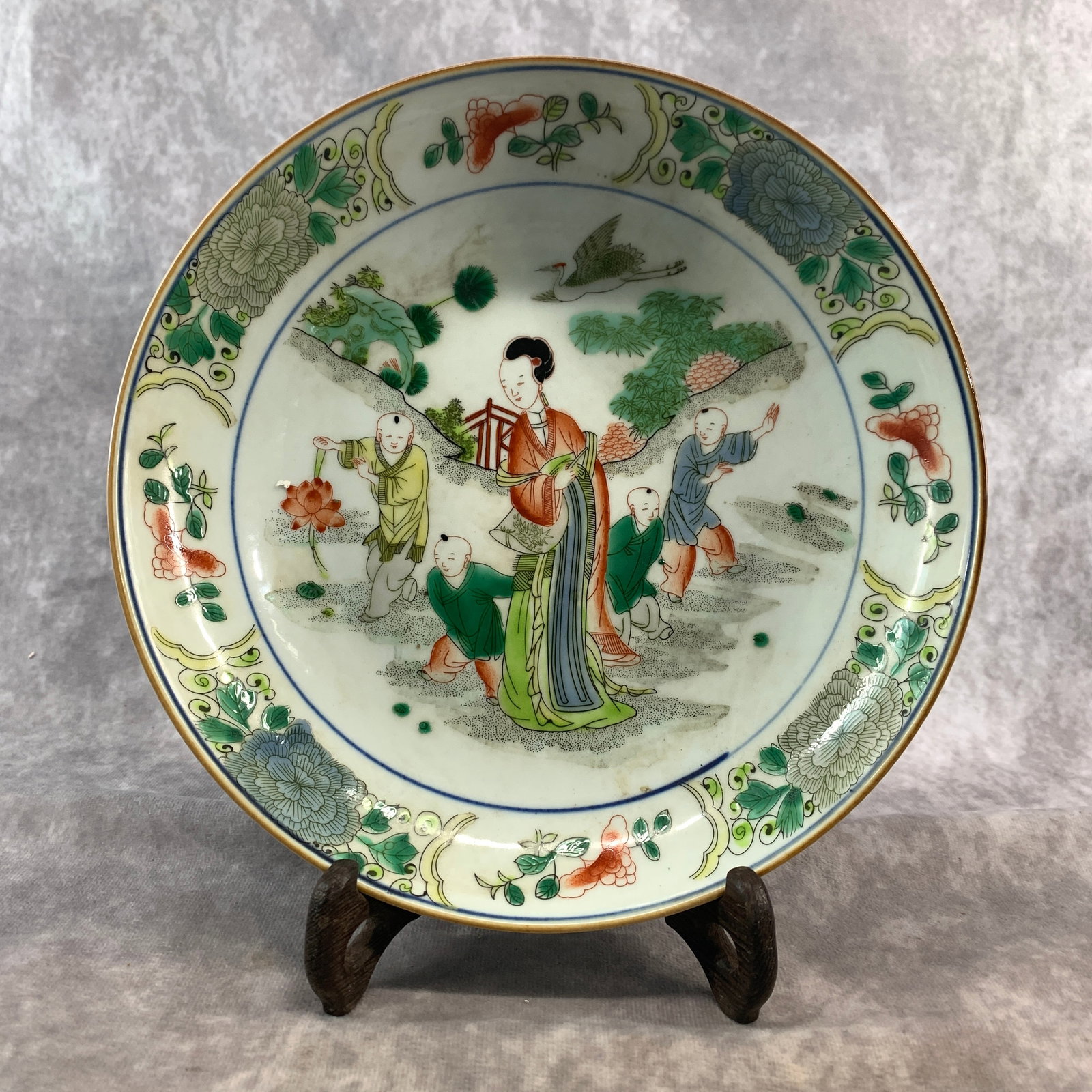 A FINE WUCAI "BOYS AT PLAY" PORCELAIN PLATE: Ming Dynasty Style; High: 1.1 inch; Diameter: 10.2 inch; ;Wooden base for picture and display only.