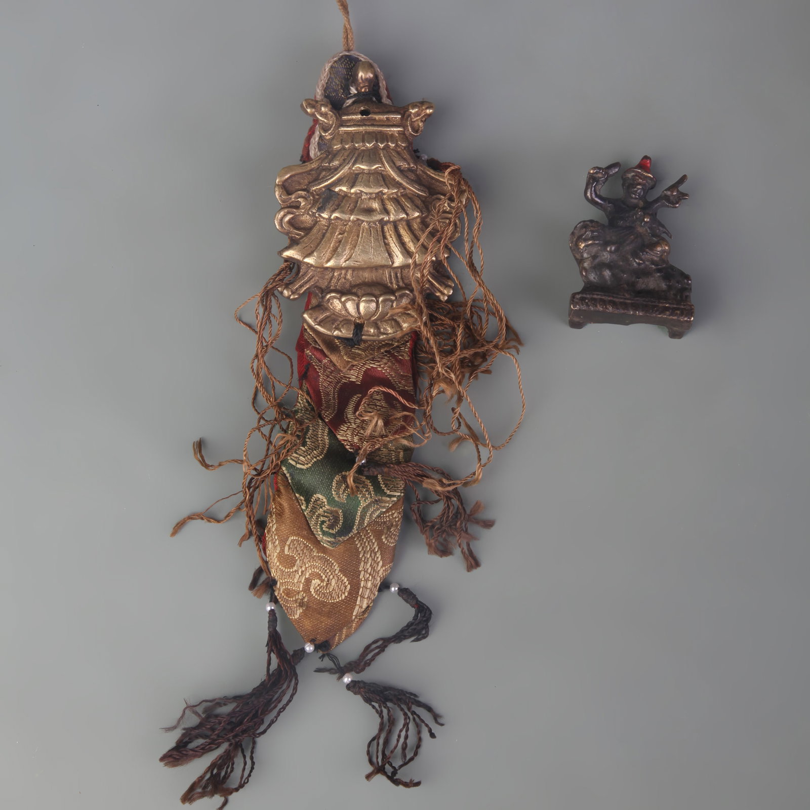 A GROUP OF TIBETAN BUDDHIST RITUAL IMPLEMENTS: Qing Dynasty; Long: 2.2 inch to 7.5 inch ;Wooden base for picture and display only.