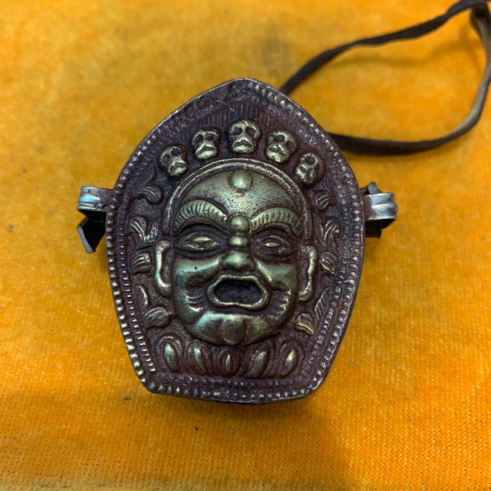 A FINE TIBETAN BUDDHIST GAWU PENDANT: 20th Century; High: 2.2 inch; Width: 1.7 inch; Long: 1.0 inch ;Wooden base for picture and display only.