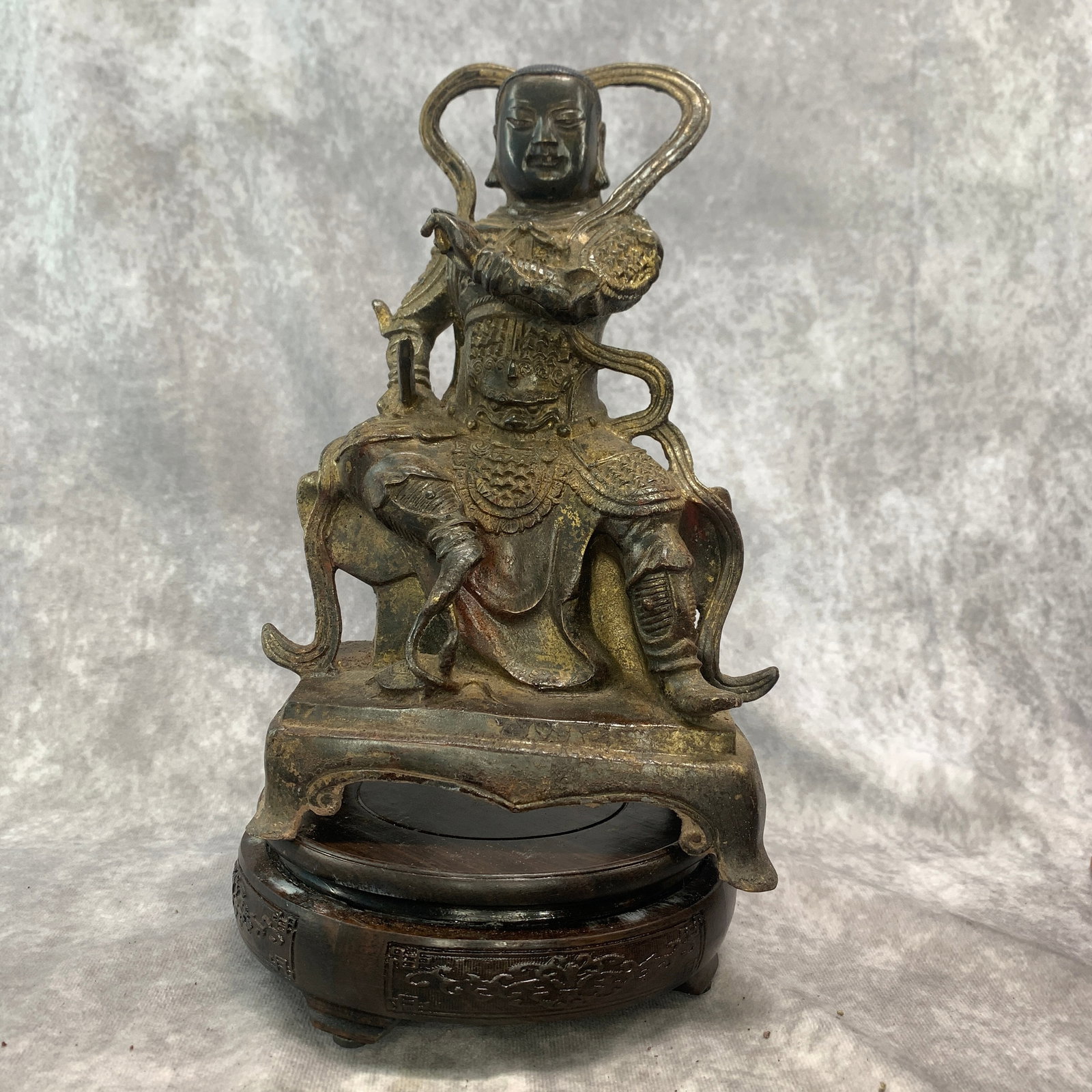 A FINE BRONZE DAOIST MARTIAL DEITY STATUE: Qing Dynasty; Long: 6.3 inch; Width: 4 inch; High: 10 inch; ;Wooden base for picture and display only.