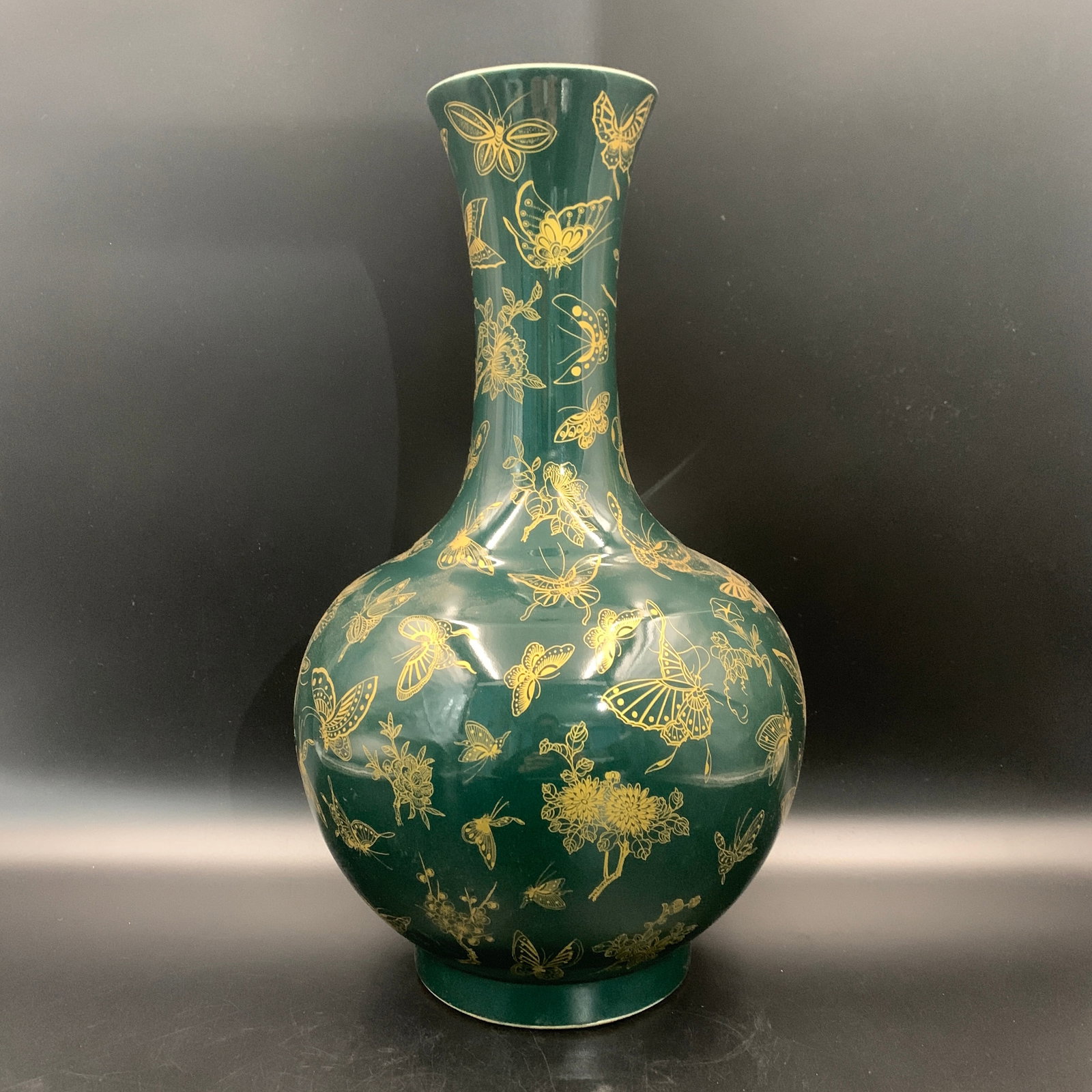 GREEN-GLAZED GILT "BUTTERFLIES PATTER" PORCELAIN VASE: Qing Dynasty; High: 16.6 inch; Diameter: 10 inch; ;Wooden base for picture and display only.