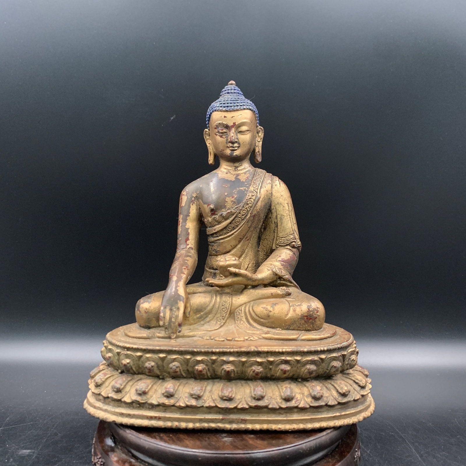 A FINE GILT-BRONZE SEATED MEDICINE BUDDHA: Ming Dynasty Style; Long: 6.9 inch; Width: 4.6 inch; High: 8.3 inch; ;Wooden base for picture and display only.