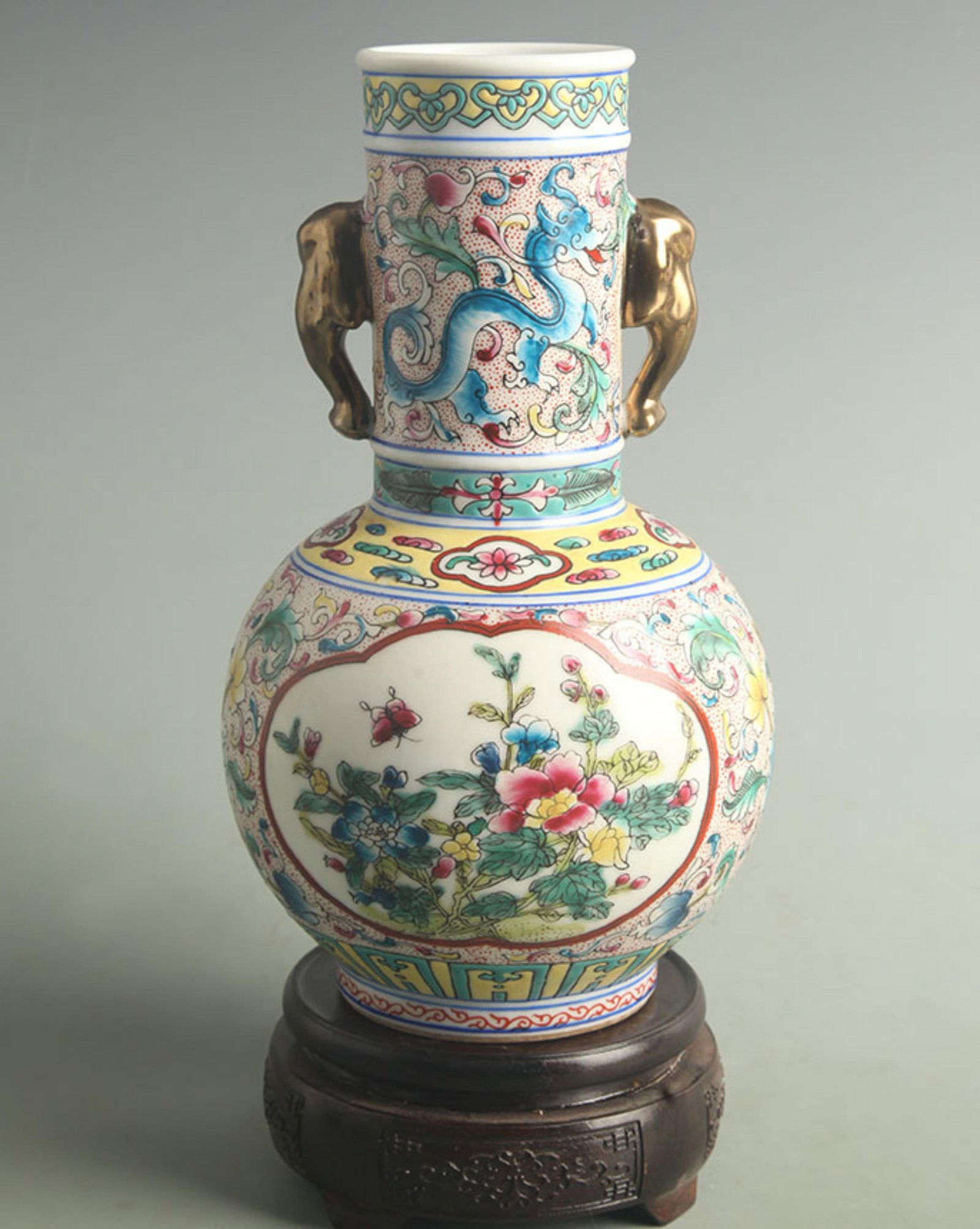 FAMILLE CLOISONNE ENAMEL COLOR ELEPHANT EAR PORCELAIN BOTTLE: Qing Dynasty Qian Long Period; High: 9.00 inch; Width: 5.00 inch; ;Wooden base for picture and display only.