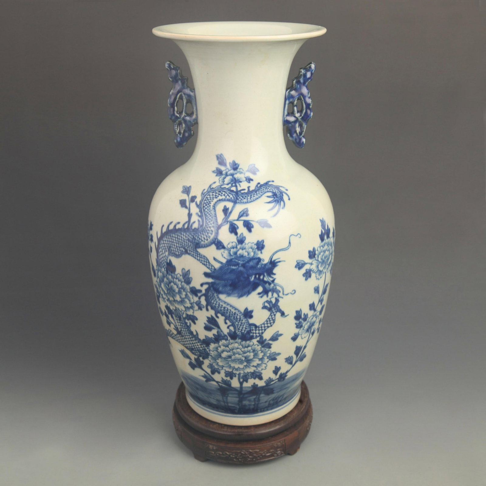 BLUE AND WHITE DRAGON DESIGN DOUBLE EAR PORCELAIN VASE: Qing Dynasty; High: 16.3 inch; Diameter: 7.50 inch; ;Wooden base for picture and display only.