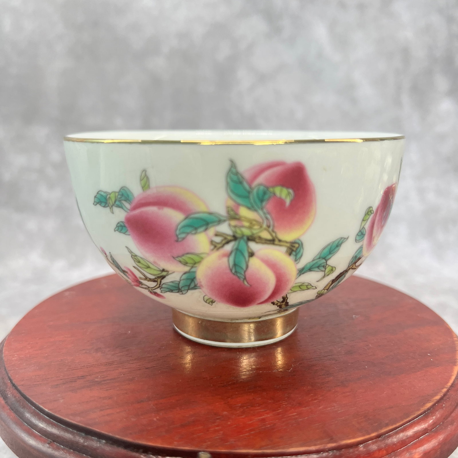 A FINE DOUCAI PORCELAIN TEACUP: Ming Dynasty Style; High: 2.1 inch; Diameter: 3.4 inch; ;Wooden base for picture and display only.