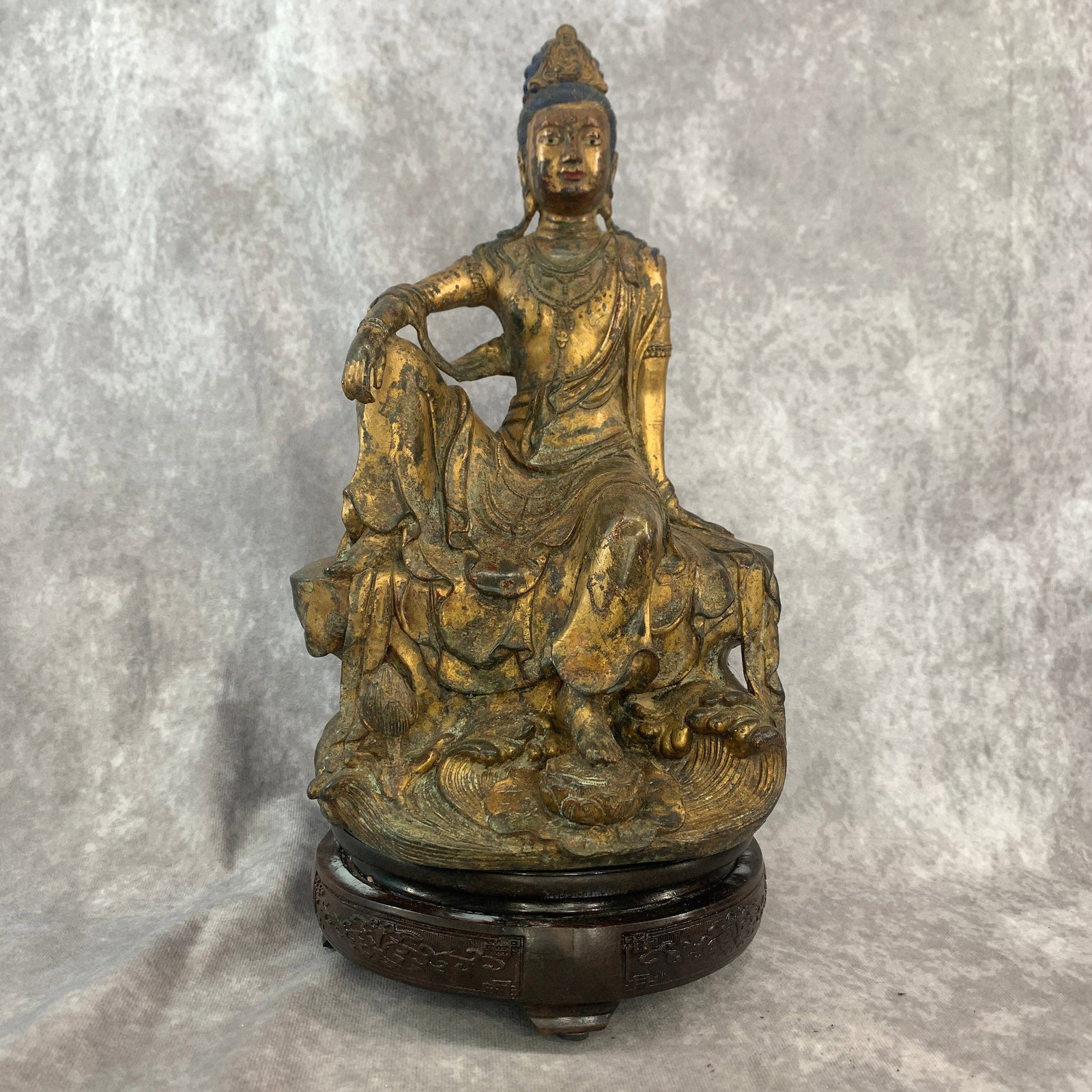 GILT-BRONZE WATER-MOON GUANYIN STATUE: Qing Dynasty; Long: 6.6 inch; Width: 5.1 inch; High: 11.6 inch; ;Wooden base for picture and display only.