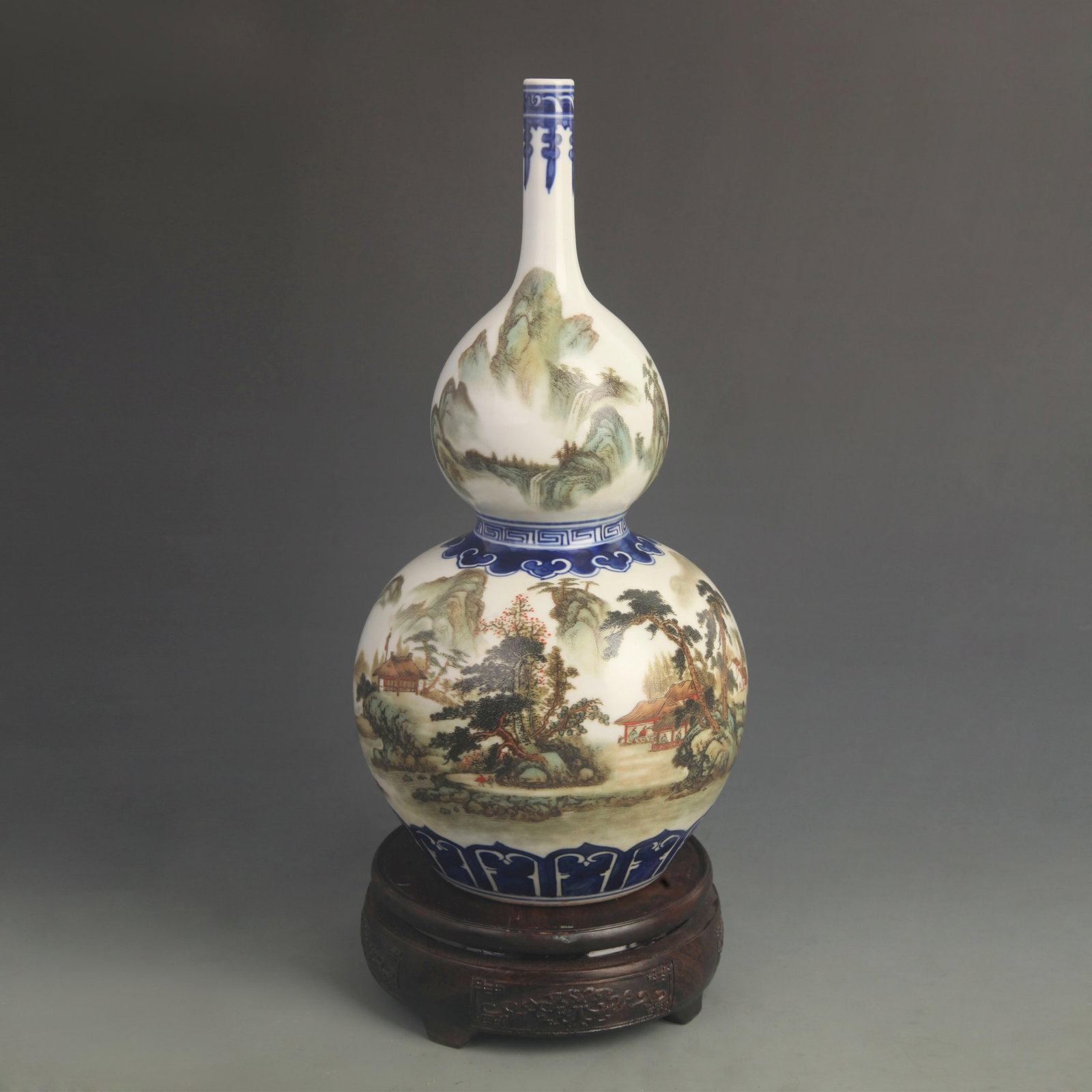 FAMILLE-ROSE LANDSCAPE LONG-NECKED GOURD STYEL PORCELAIN VASE: Qing Dynasty Qian Long Period; High: 12.0 inch; Diameter: 5.50 inch; ;Wooden base for picture and display only.