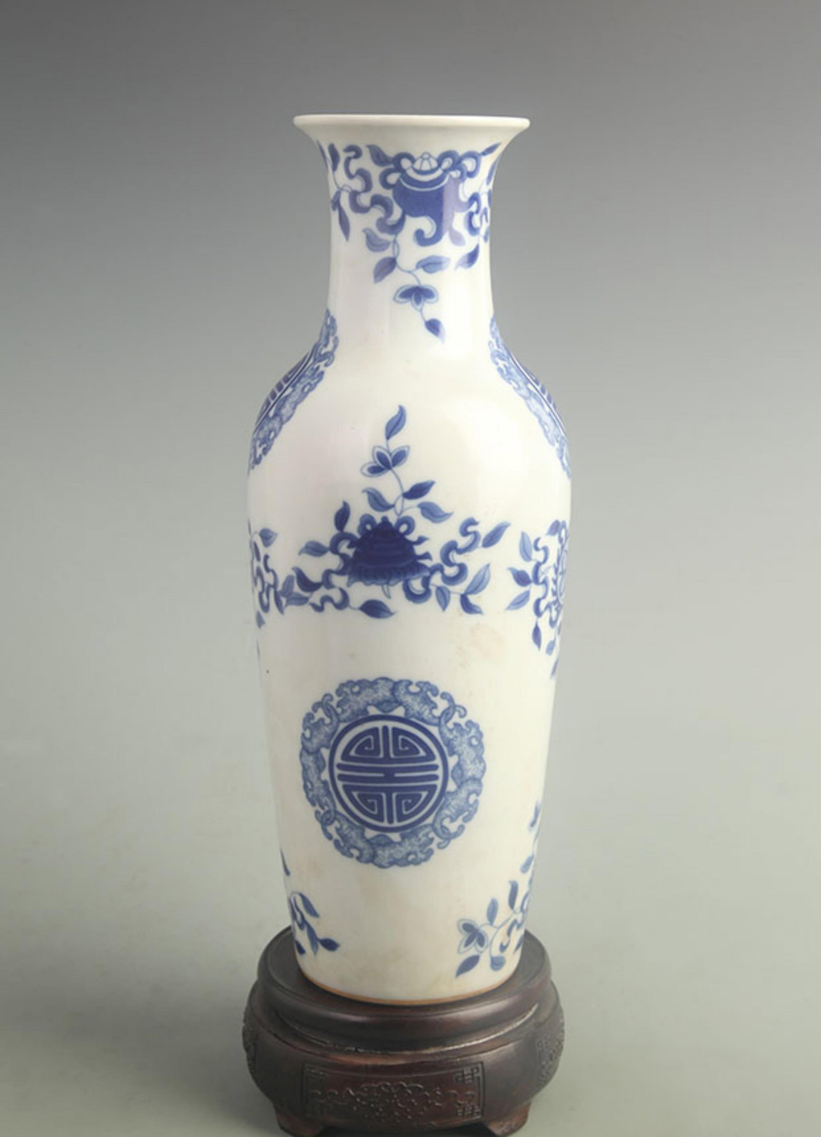 BLUE AND WHITE VASE WITH FLOWER AND LONGEVITY DESIGN: Qing Dynasty Kang Xi Period; High: 12.0 inch; Width: 4.50 inch; ;Wooden base for picture and display only.