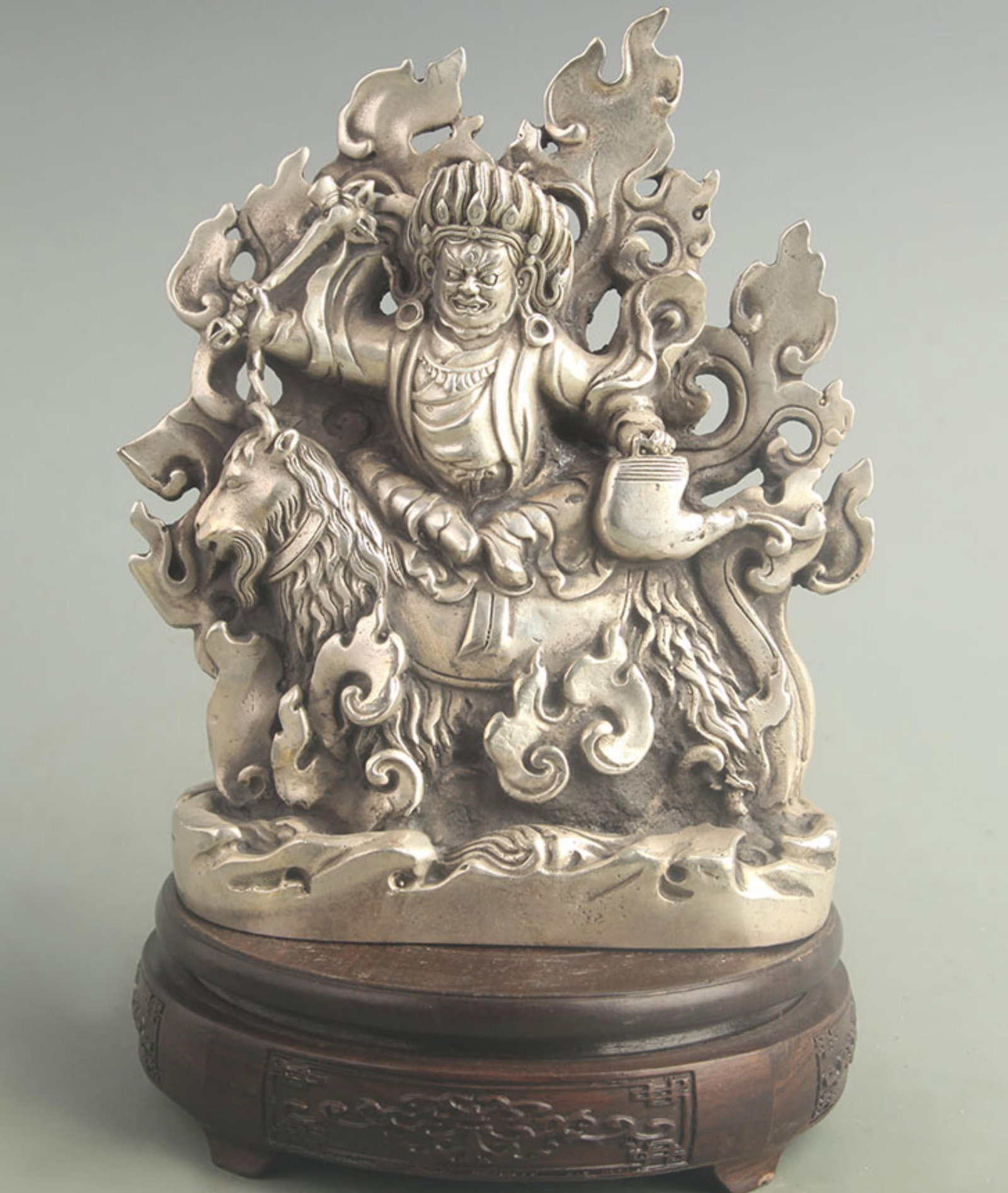 A SILVER GILTTIBETAN-STYLE PROTECTOR DEITY FIGURE: 19th Century; High: 8.00 inch; Width: 3.20 inch; Long: 5.80 inch ;Wooden base for picture and display only.