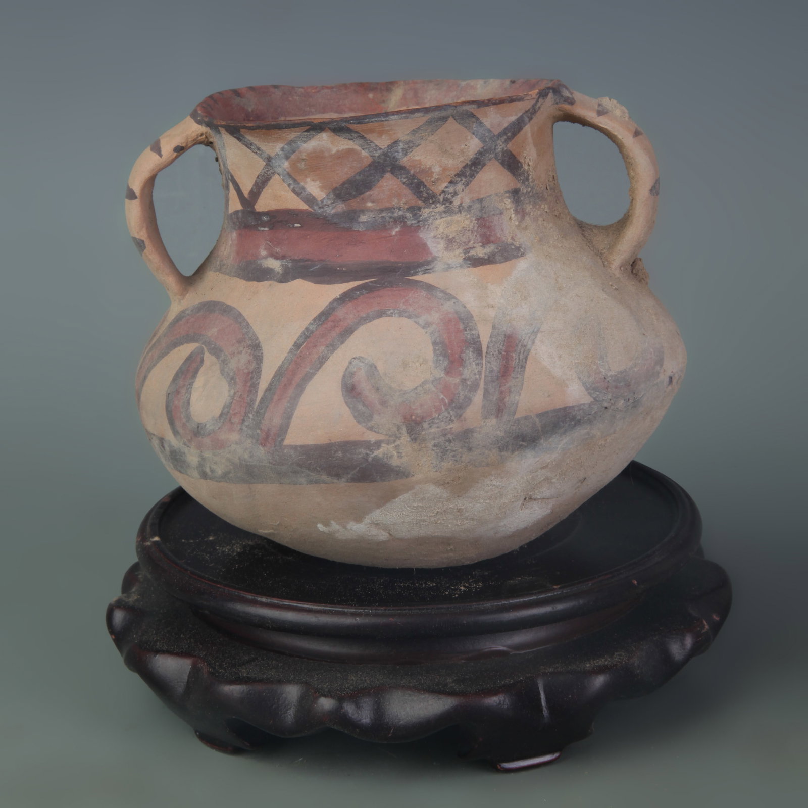 A PAINTED YANGSHAO CULTURE DOUBLE-HANDLED POTTERY JAR: New Stone Age Style; Diameter: 3.0 inch; High: 4.2 inch ;Wooden base for picture and display only.