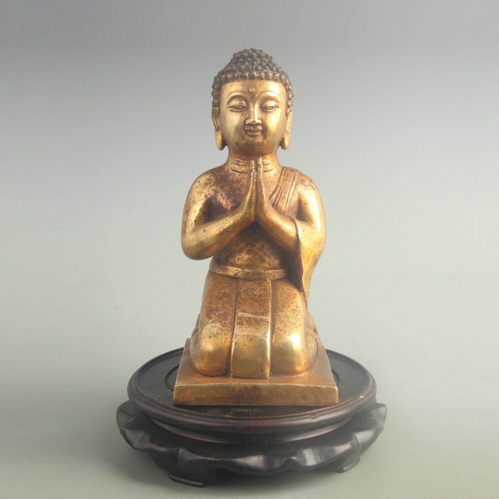 A FINE GILT-BRONZE KNEELING BUDDHA: 19th Century; High: 9.20 inch; Width: 4.20 inch; ;Wooden base for picture and display only.