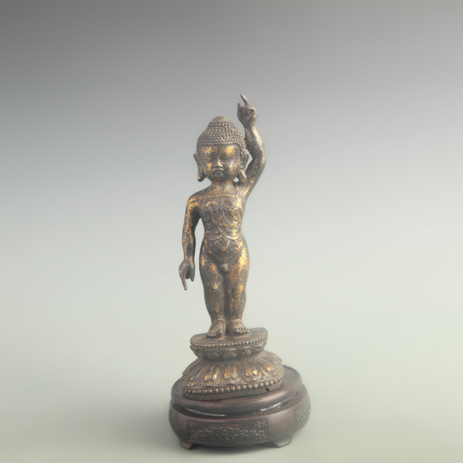 A GILT BRONZE CROWN PRINCE BUDDHA FIGURE: 19th Century;High: 11.0 inch; Width: 2.60 inch; Long: 3.80 inch ;Wooden base for picture and display only.