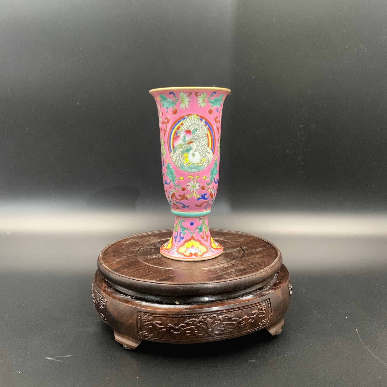 FAMILLE ROSE PINK-GROUND GU-STYLE CUP: Qing Dynasty; High: 5.3 inch; Diameter: 2.6 inch; ;Wooden base for picture and display only.