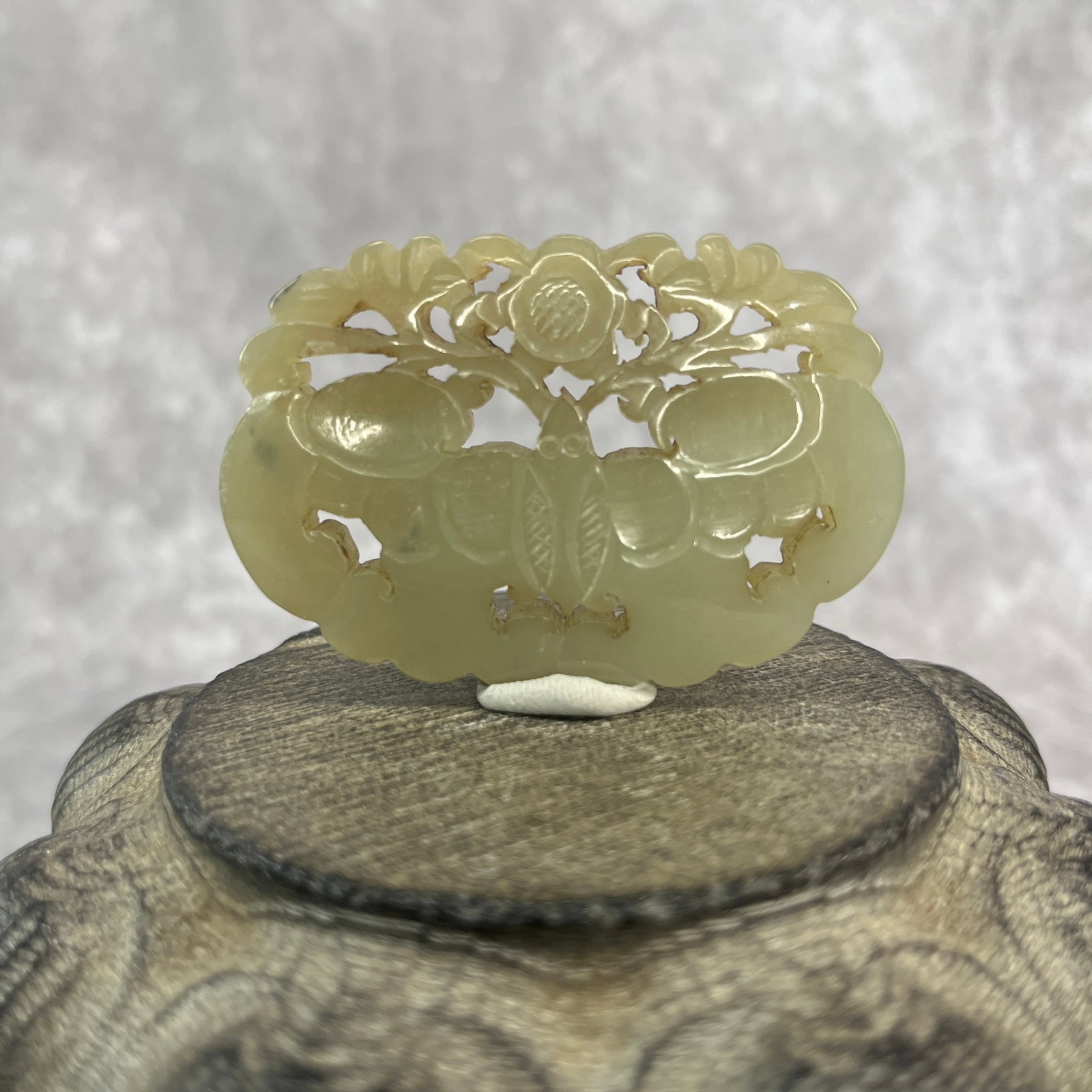 A FINE HETIAN JADE CARVING IN FIGURE OF BUTTERFLY: Republic Period; Long: 2.48 inch; Width: 1.67 inch; High: 0.32 inch; ;Wooden base for picture and display only.