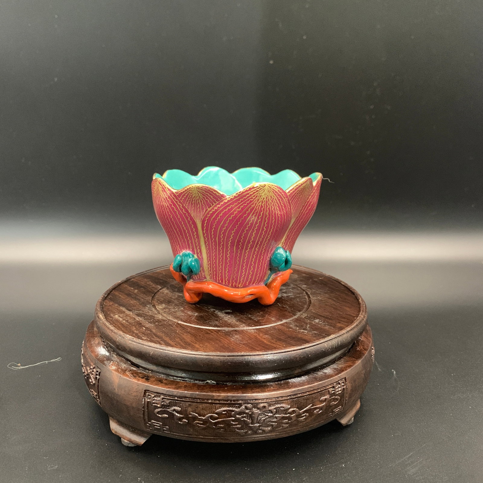 LOTUS-SHAPED FAMILLE ROSE WINE VESSEL: Qing Dynasty; High: 2.9 inch; Diameter: 3.7 inch; ;Wooden base for picture and display only.