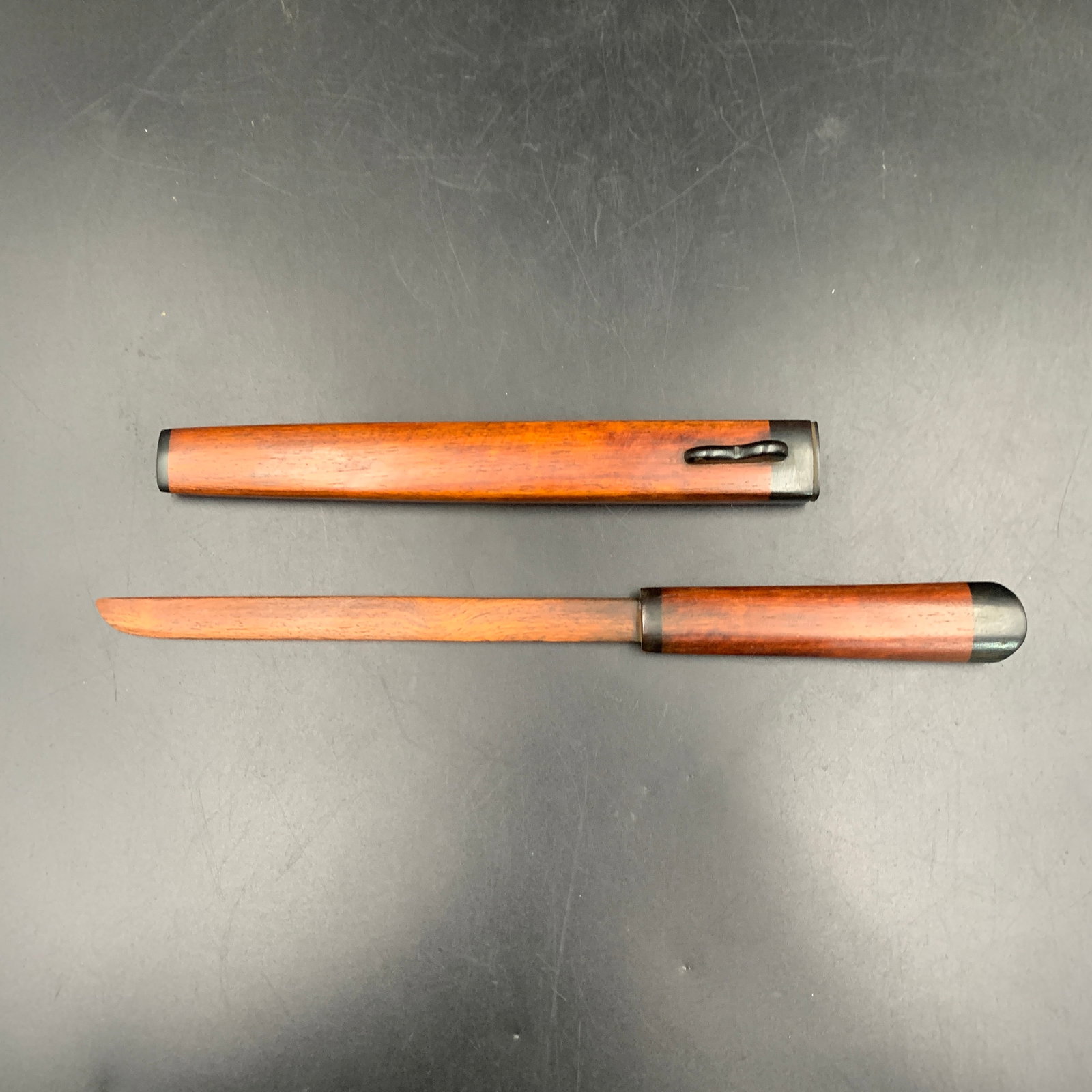 JAPANESE TANTO-STYLE WOODEN PAPER KNIFE: Republic Period; Long: 11.9 inch; Width: 0.9 inch; High: 0.9 inch; ;Wooden base for picture and display only.