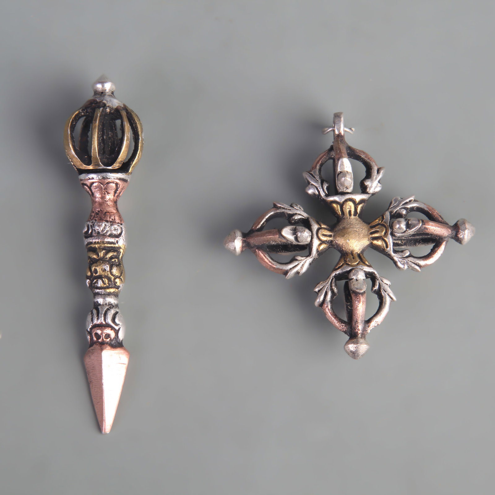 A TIBETAN BUDDHIST RITUAL VAJRA (DORJE): Republic Period; Long: 1.8 inch to 3.5 inch; Width: 0.8 inch to 1.8 inch ;Wooden base for picture and display only.