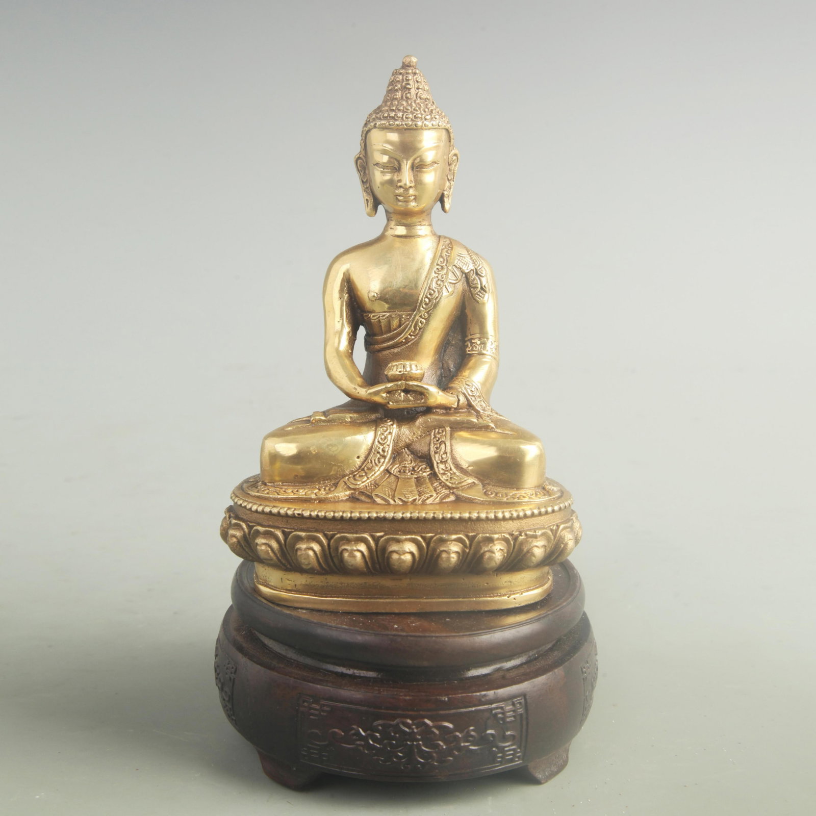 A FINE GILT BRONZE AMITAYUS BUDDHA STATUE: 20th Century; High: 6.20 inch; Width: 4.20 inch; ;Wooden base for picture and display only.