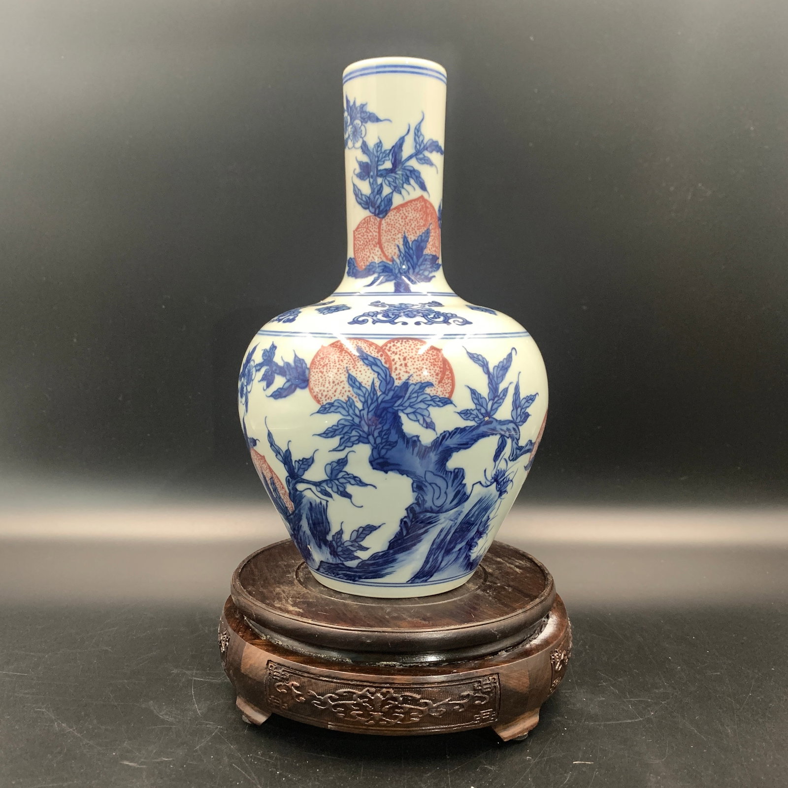 UNDERGLAZE BLUE AND WHITE PORCELAIN VASE (TIANQIUPING): Qing Dynasty; High: 9.2 inch; Diameter: 5.7 inch; ;Wooden base for picture and display only.