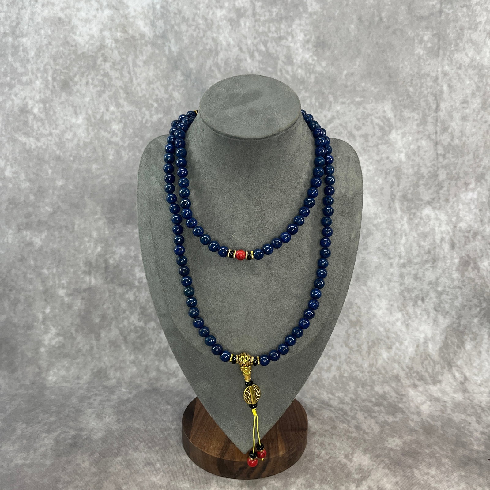 LAPIS LAZULI NECKLACE WITH CORAL SPACER: Modern; Long: 22 inch; Diameter: 0.3 inch; ;Wooden base for picture and display only.