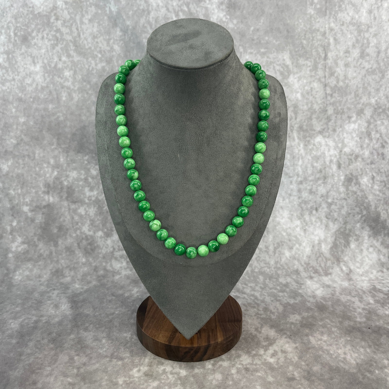 A FINE JADEITE NECKLACE: Modern; Long: 10.1 inch; Diameter: 0.4 inch; ;Wooden base for picture and display only.