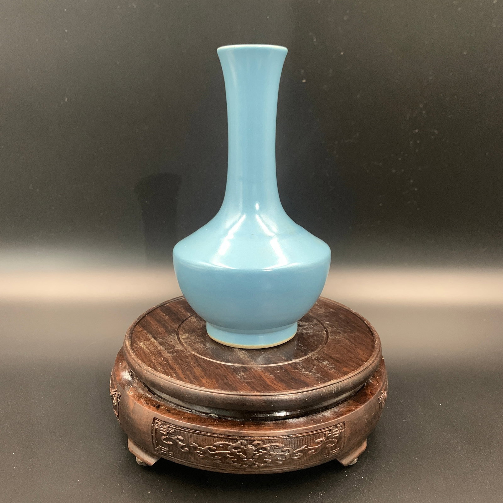 SMALL SKY-BLUE MONOCHROME BOTTLE VASE: Qing Dynasty; High: 6.4 inch; Diameter: 3.7 inch; ;Wooden base for picture and display only.