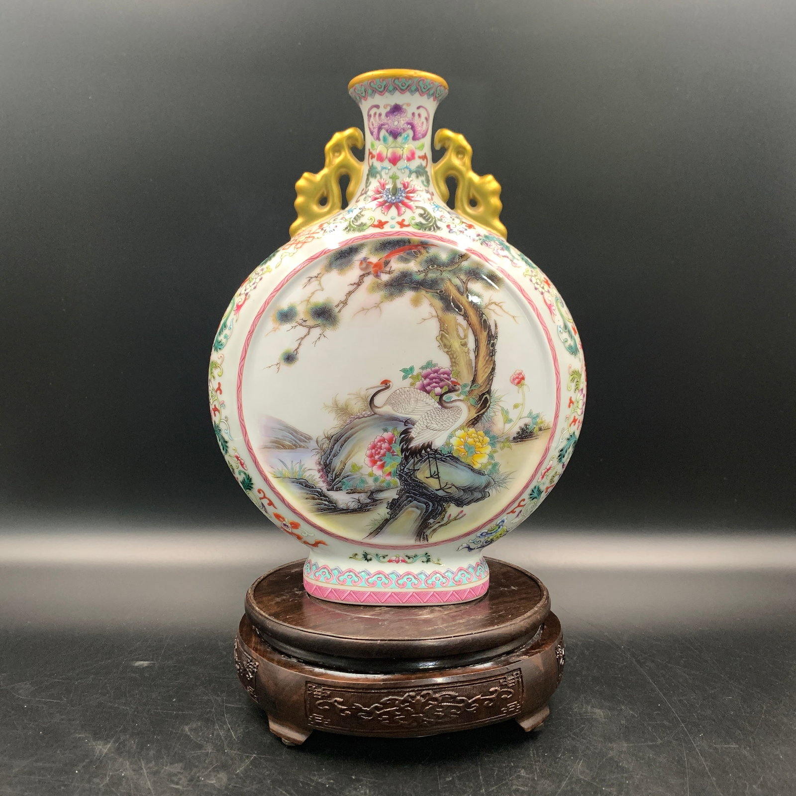 FAMILLE ROSE "CRANES AND PINE" MOONFLASK (BAOYUEPING): Republic Period; Long: 7.6 inch; Width: 3.3 inch; High: 10.1 inch; ;Wooden base for picture and display only.