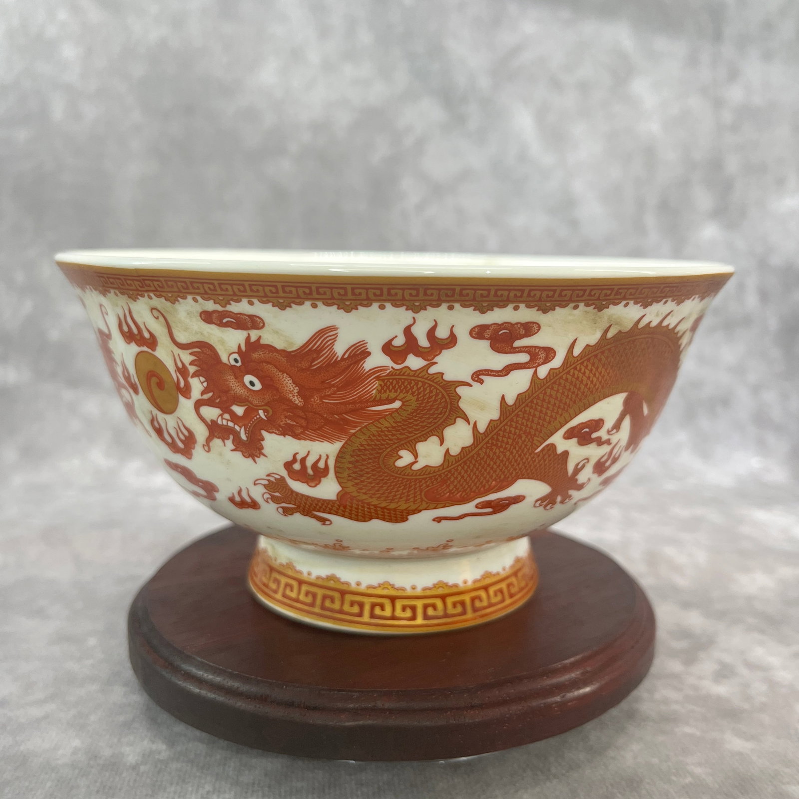 IRON-RED GLAZED "IMPERIAL DRAGON" PORCELAIN BOWL: Qing Dynasty; High: 3.2 inch; Diameter: 6.2 inch;;Wooden base for picture and display only.